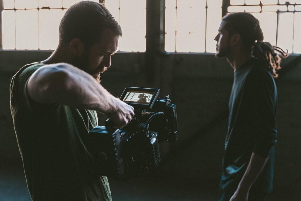A boy setting his camera