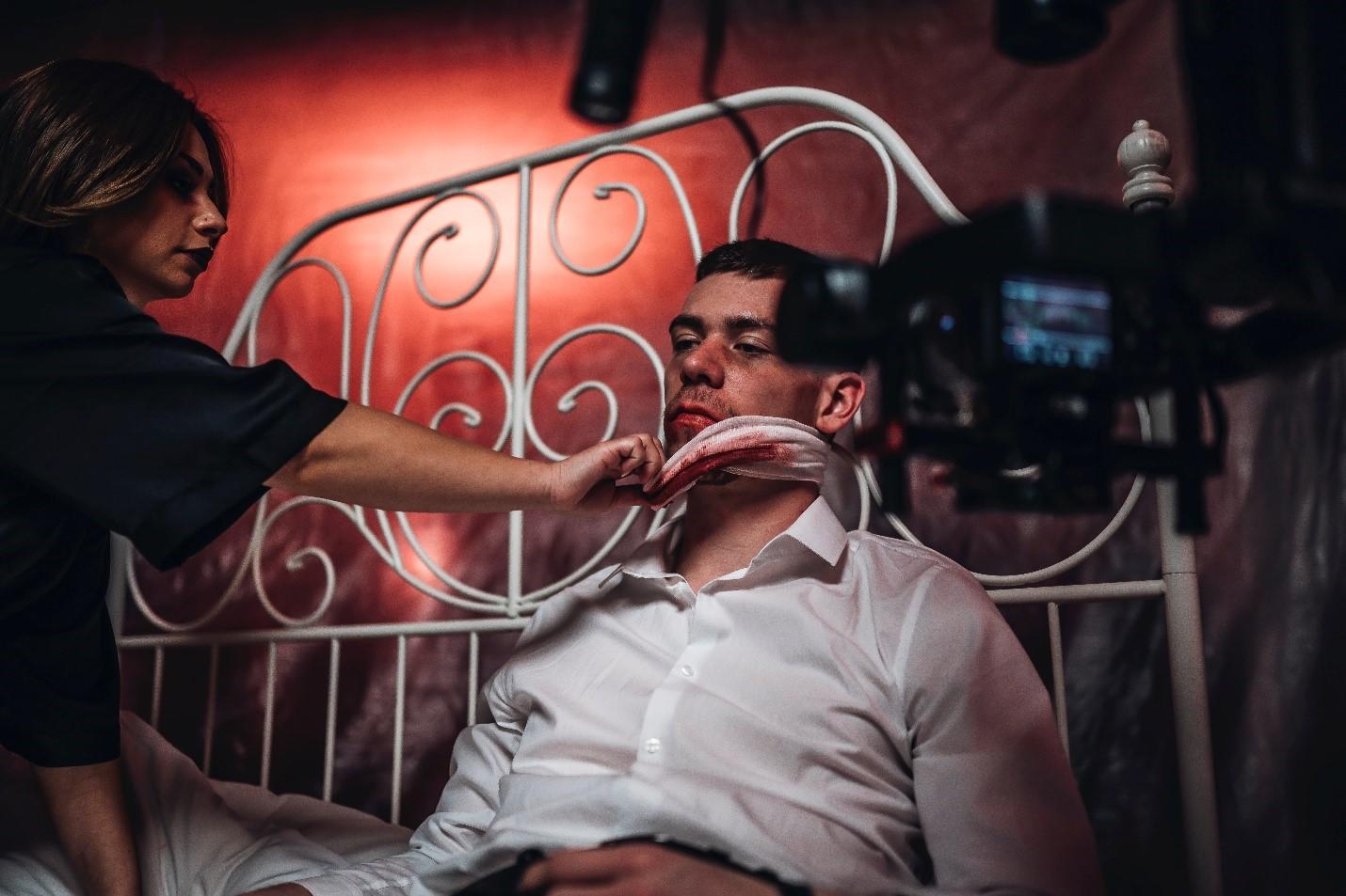 A man prepping to film a scene