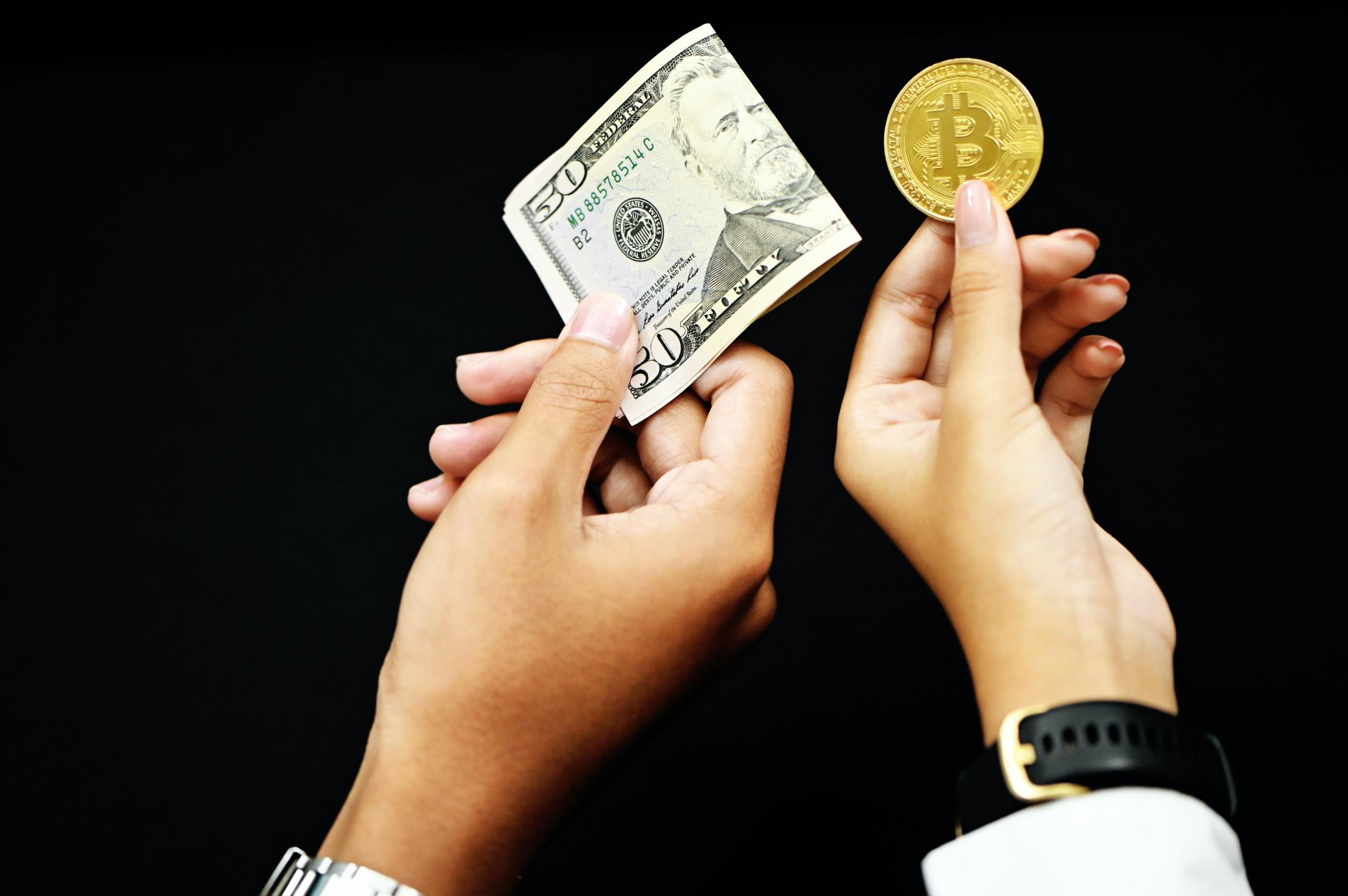 People exchanging money and Bitcoin