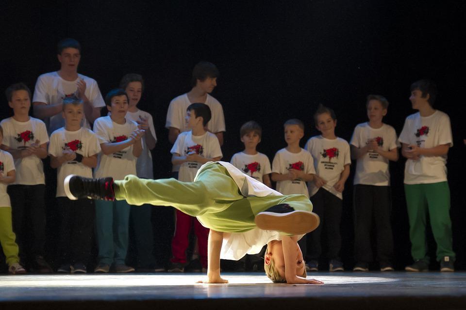 A kid displaying his dancing skills in a hip-hop battle