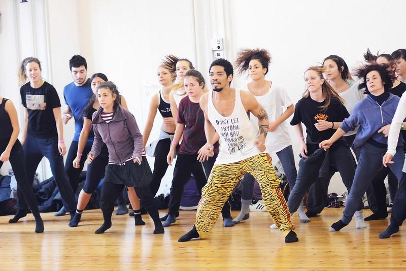 People practicing a hip hop dance routine in a studio