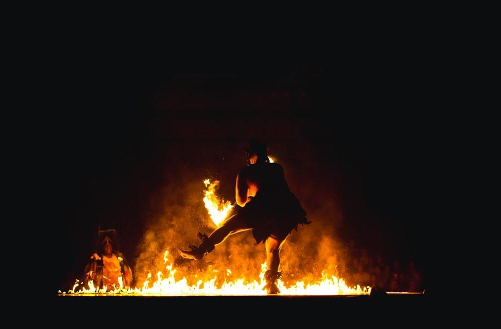 A man performing an African dance stunt