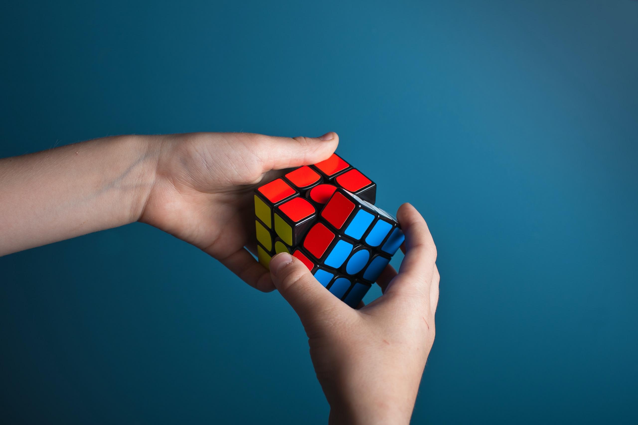 One kid solving a Rubik cube