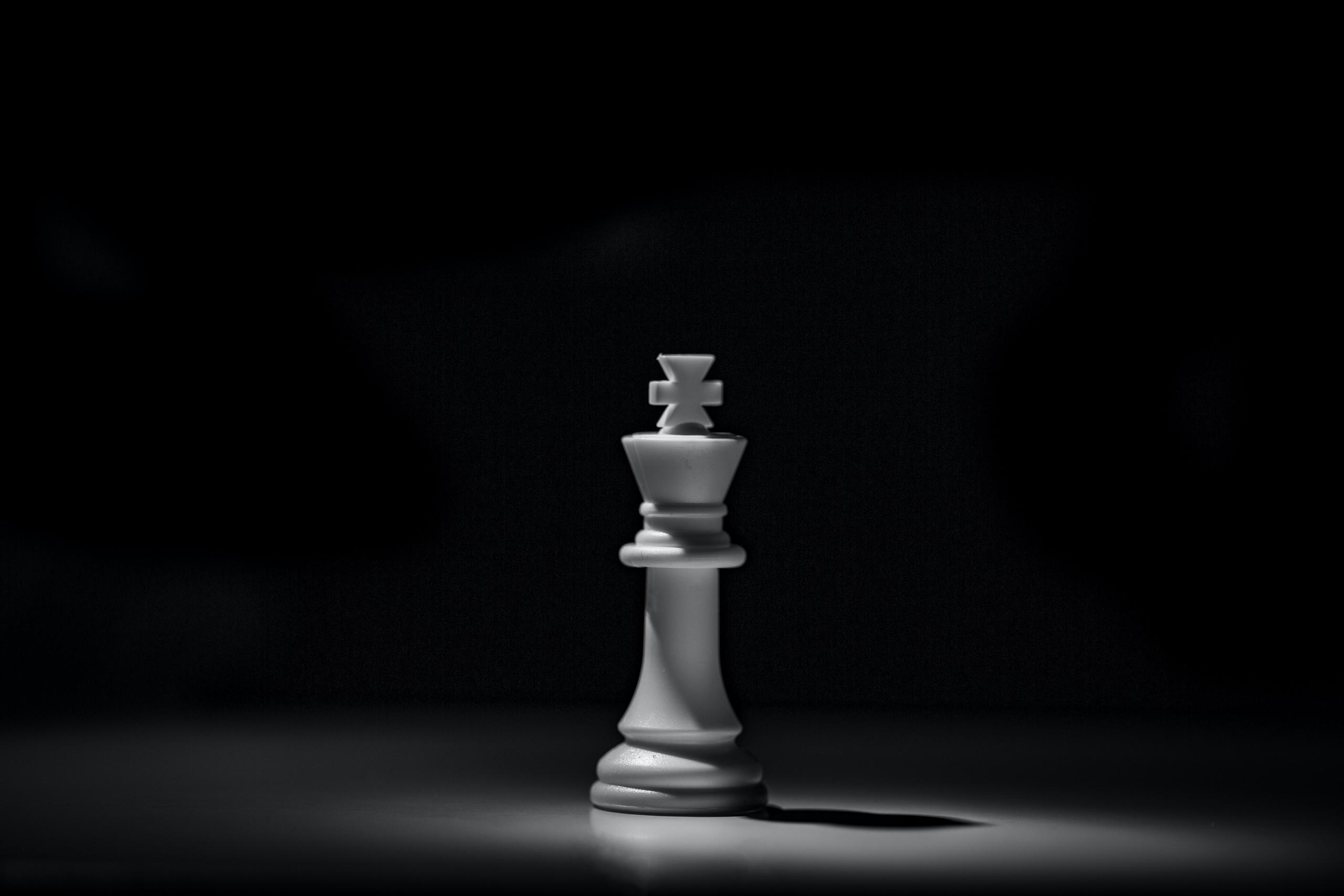 A black and white shot of a chess piece called "Bishop."