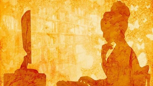 A woman writing creative content on her computer