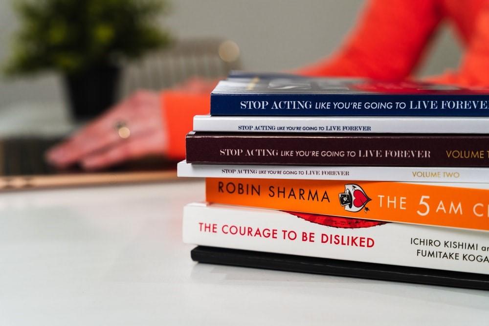 A stack of books on a white table in a school