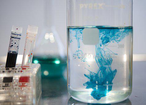 A beaker showing the chemical reaction of inorganic compounds