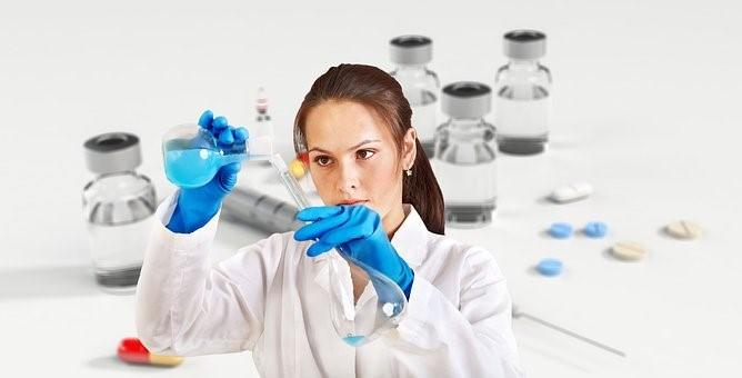 A woman experimenting with inorganic compounds