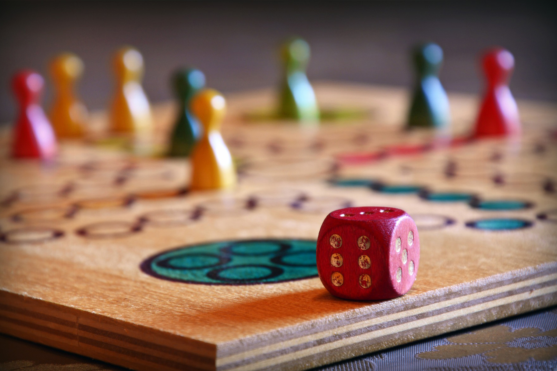 A board game being played with a dice