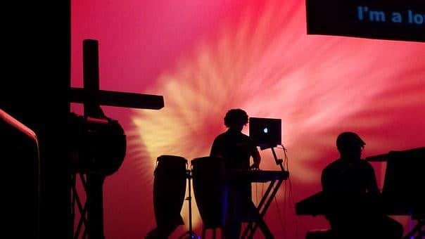 A gospel music band performing on stage