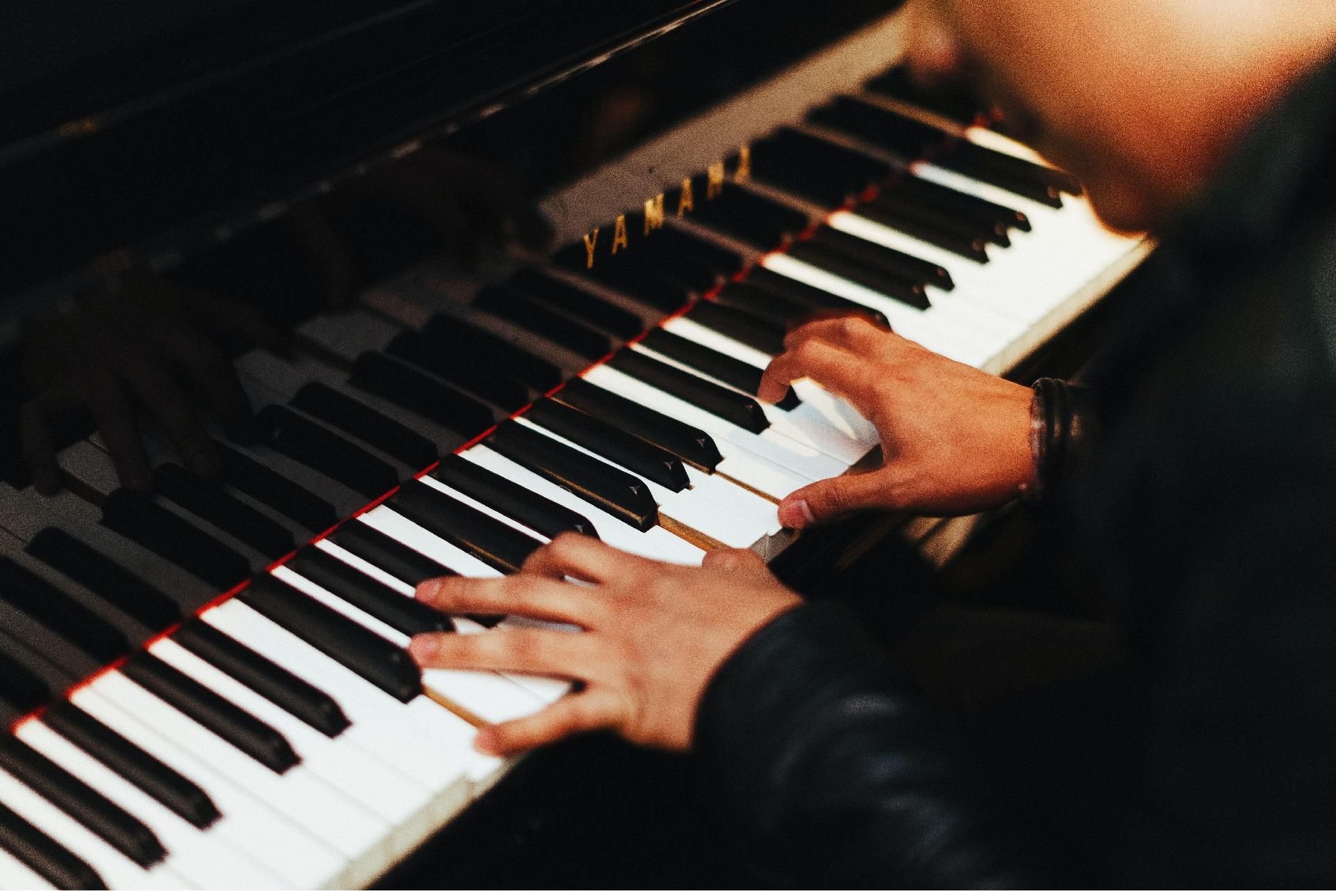 A musician playing piano at a gospel concert