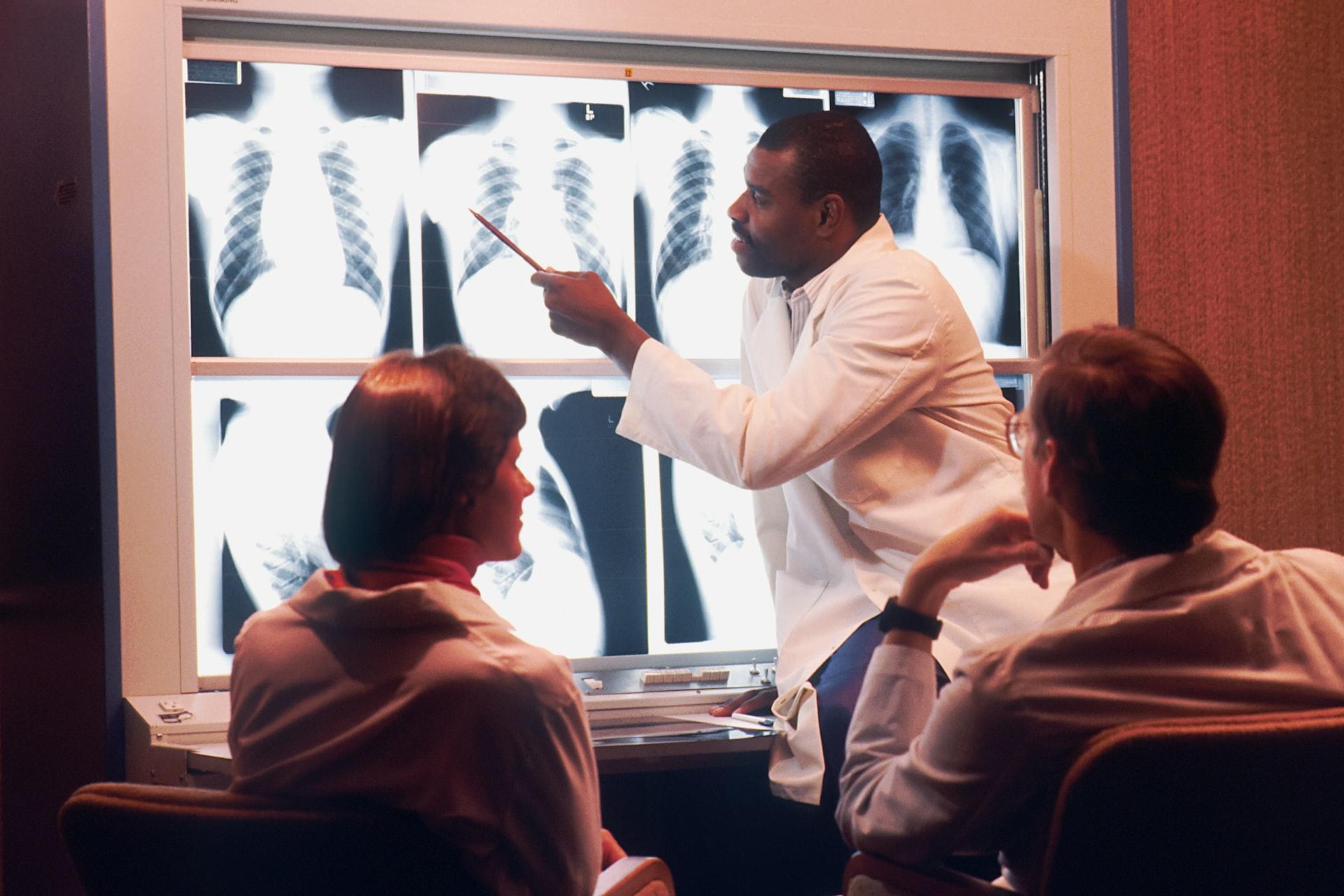 Doctor with patients and x-rays