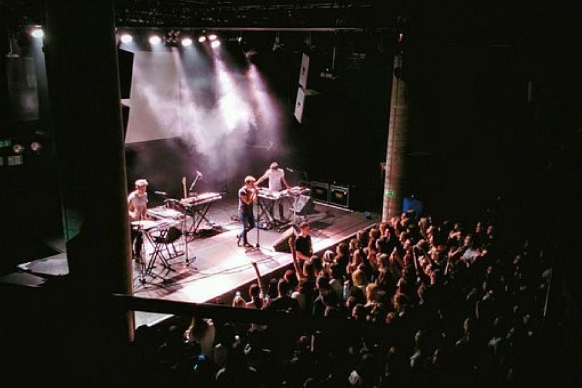 A band giving a pop music performance
