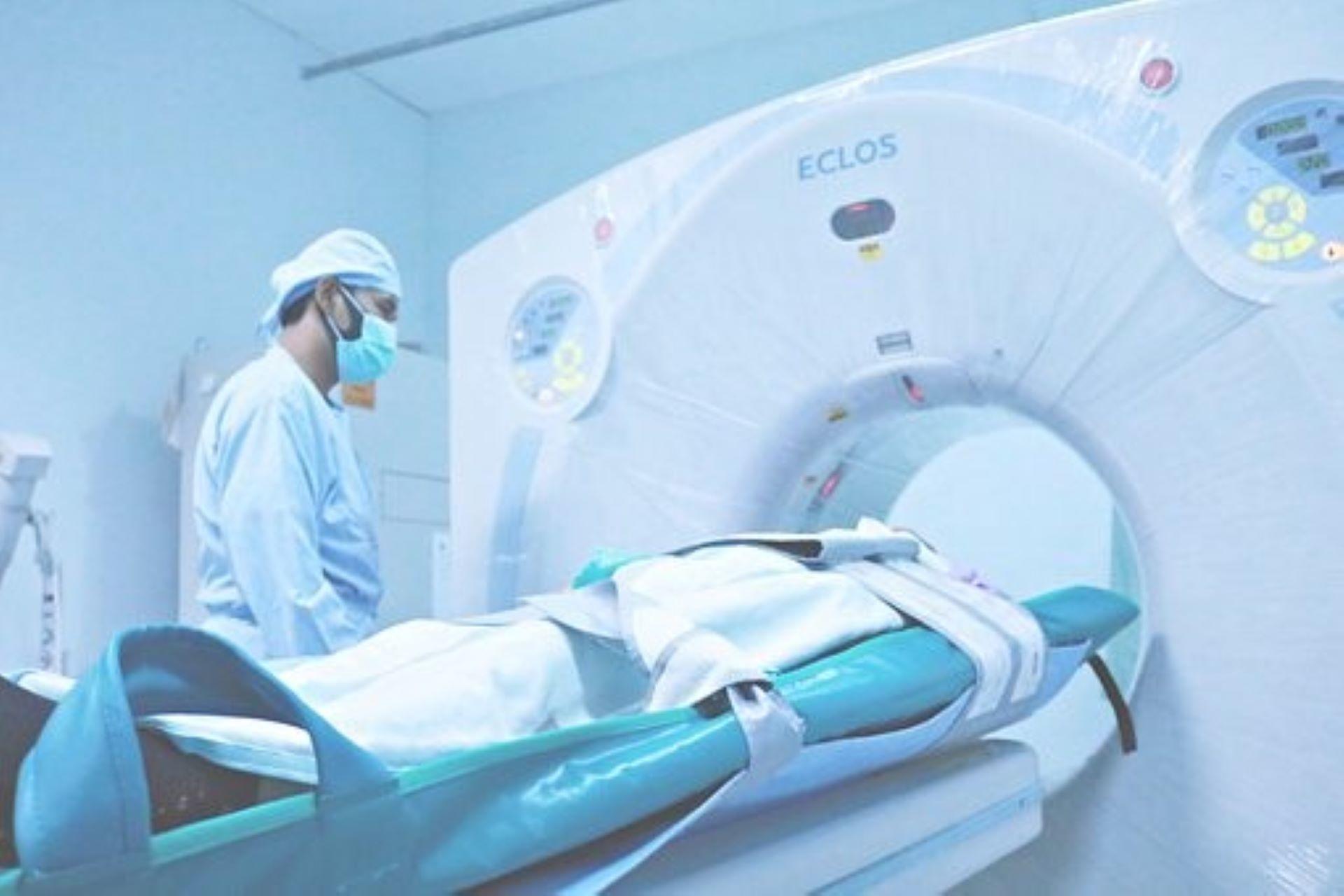 A physicist conducting a CT scan of a patient.