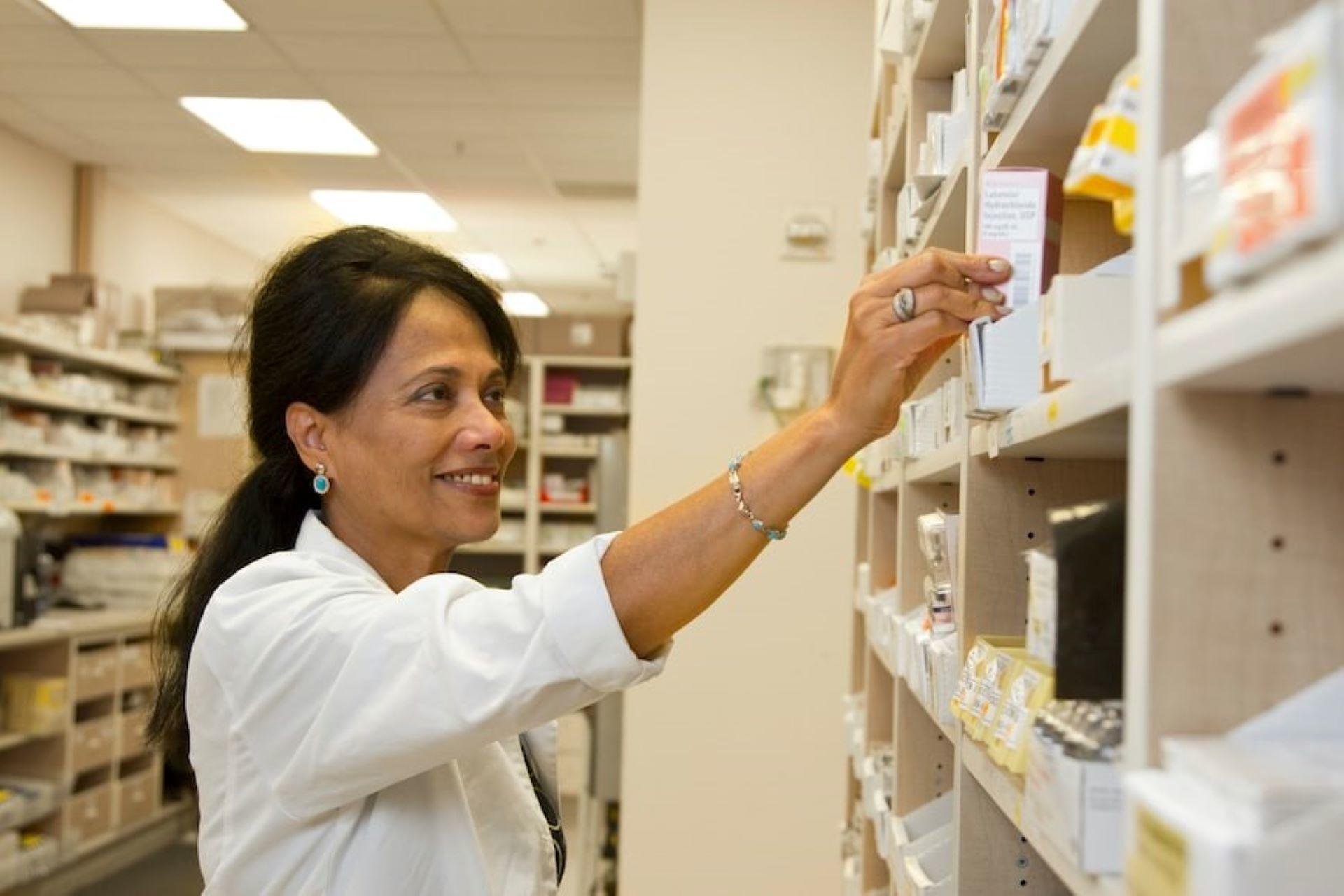 A pharmacist checking medicines
