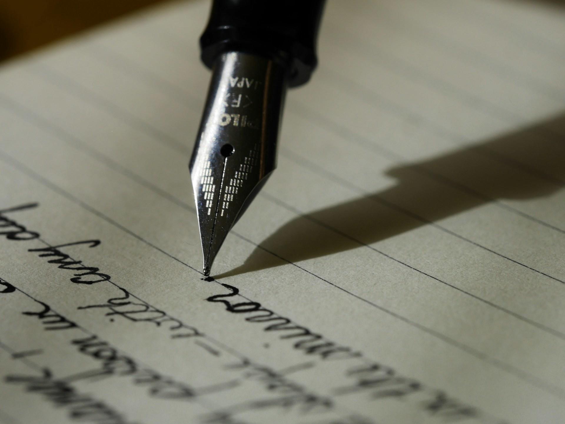 An ink pen on a piece of paper.