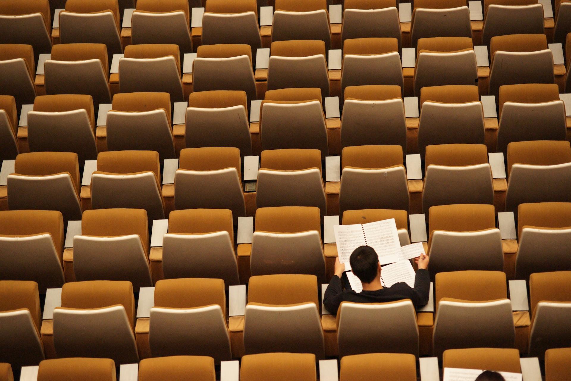 Solitary student in lecture hall