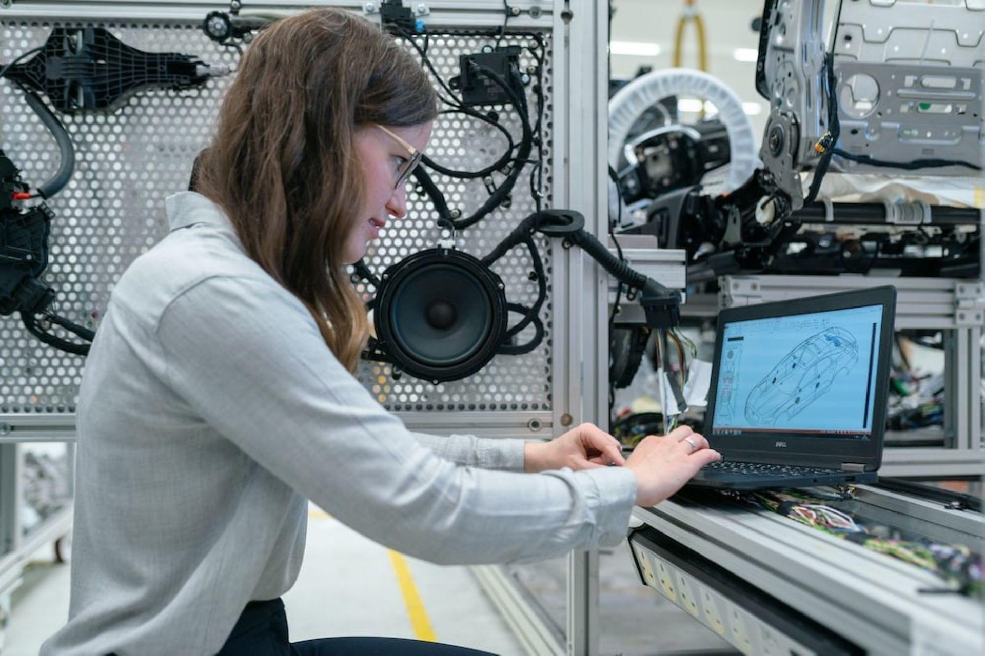 A female electronics engineer running a vehicle test