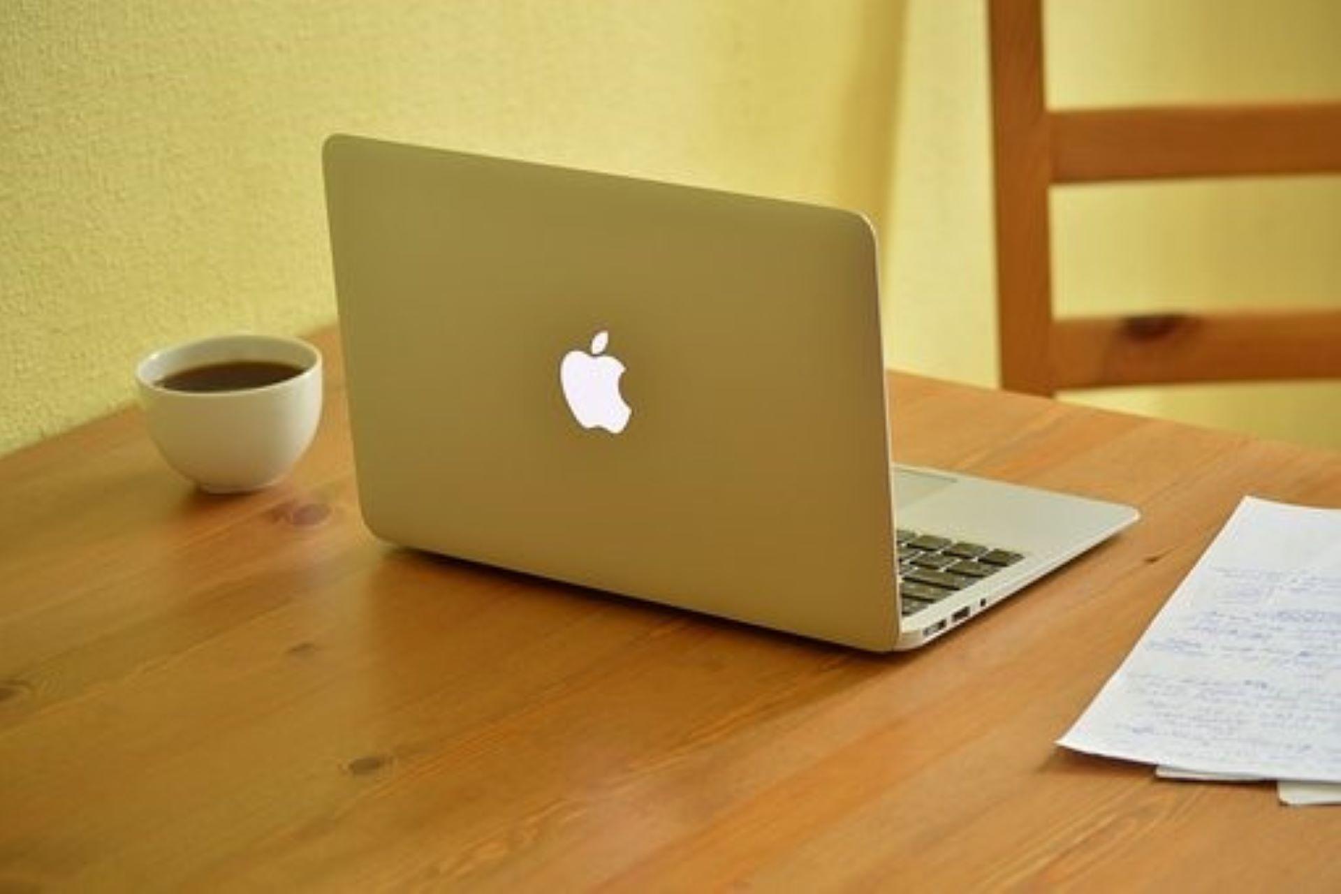 An online learner's study space with a laptop.