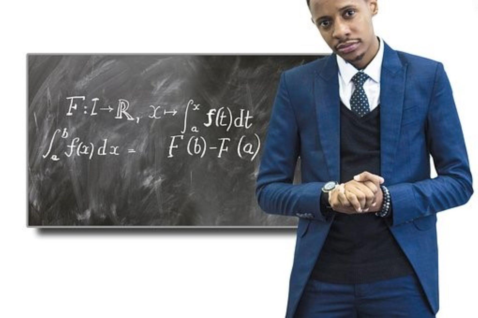 A physics teacher delivering a lecture.