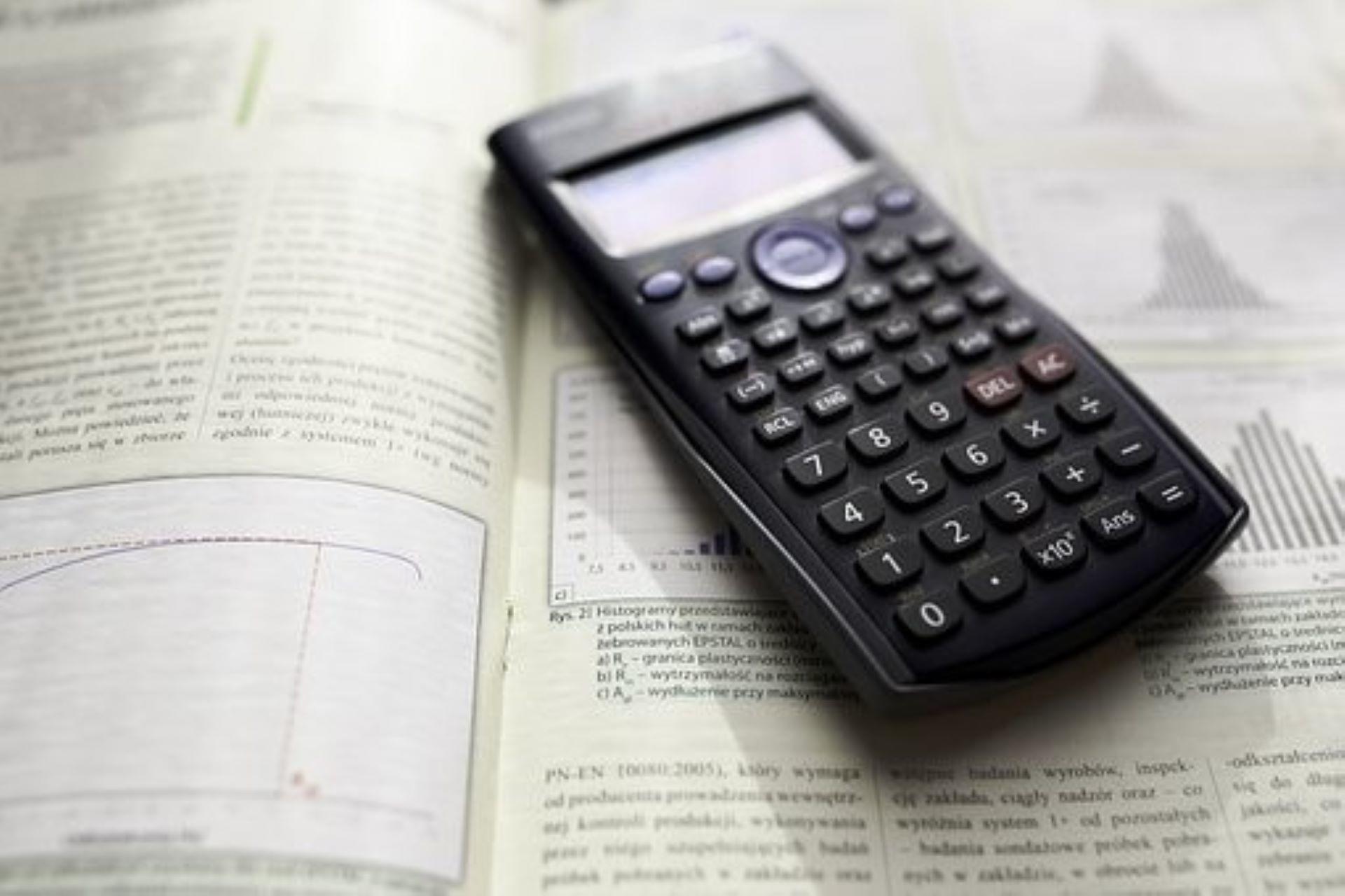 A business statistics book and calculator.