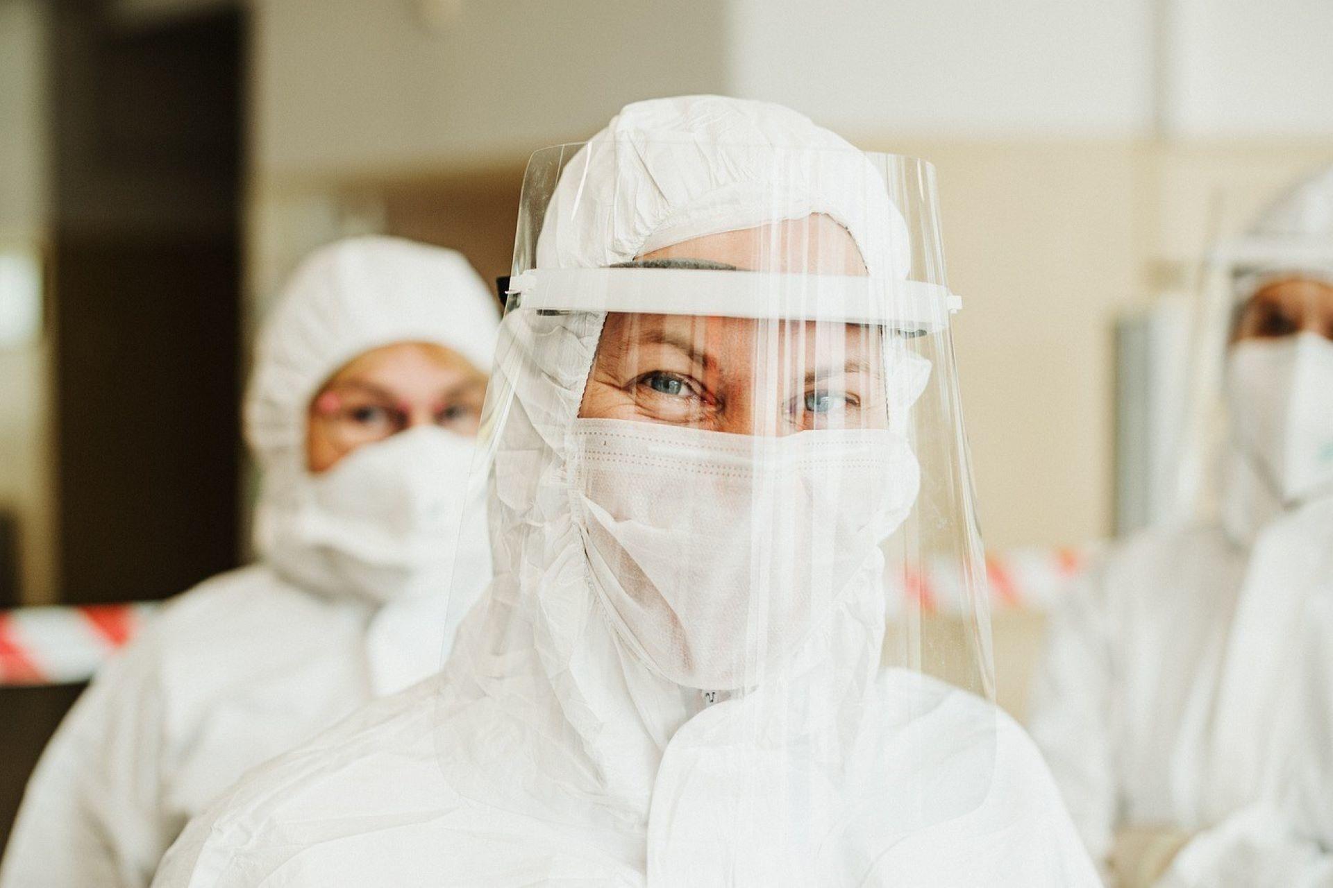 A chemical scientist wearing laboratory PPE.