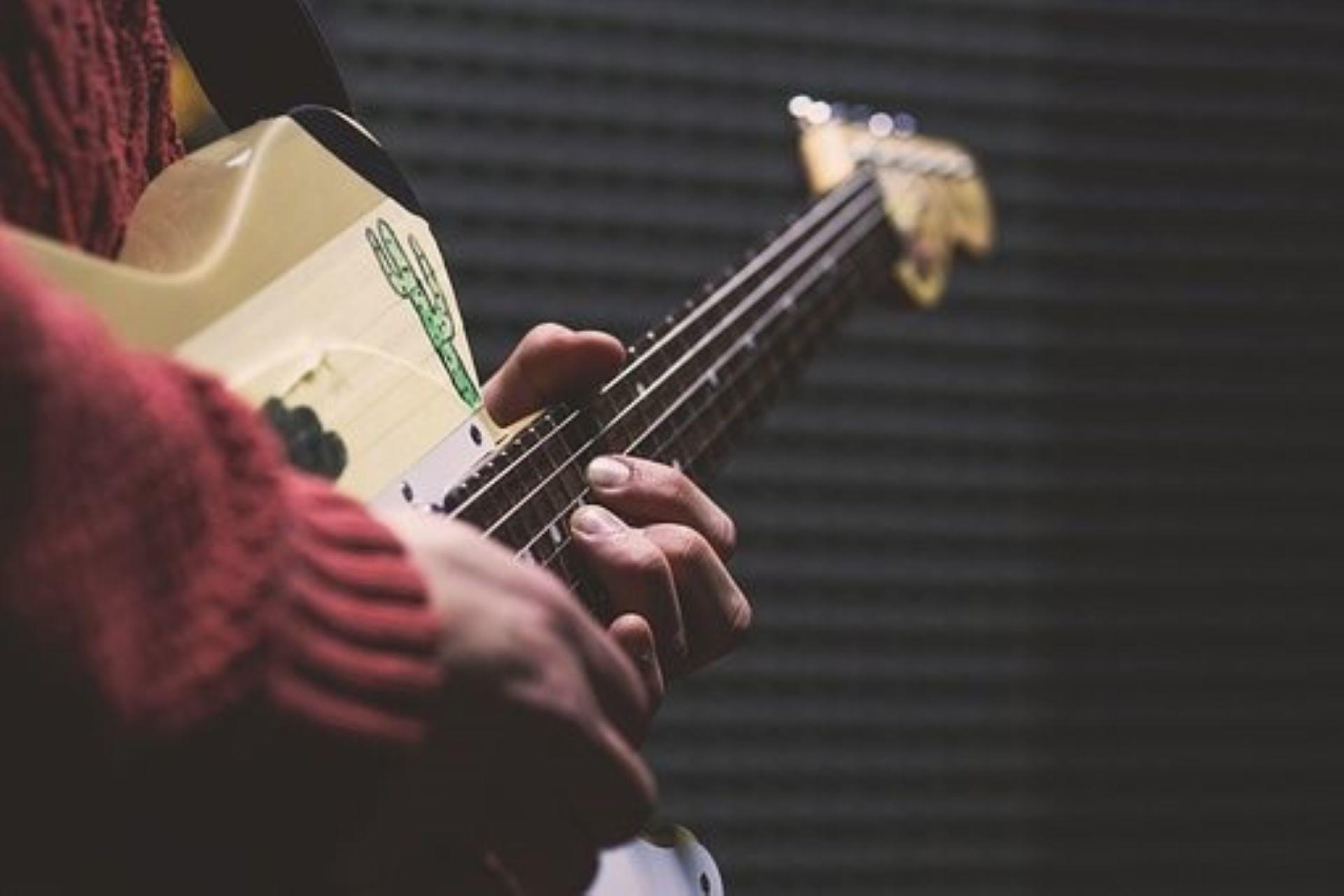 A guitarist playing the resonator guitar.