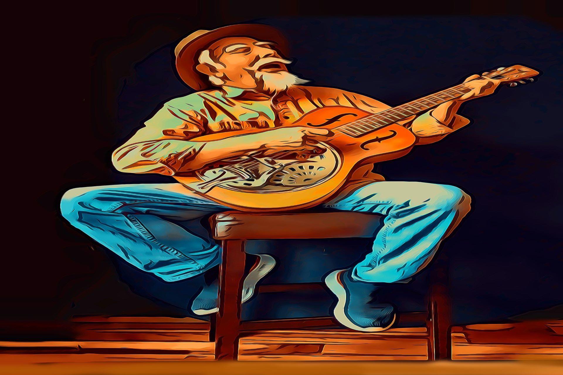 A man playing a resonator guitar