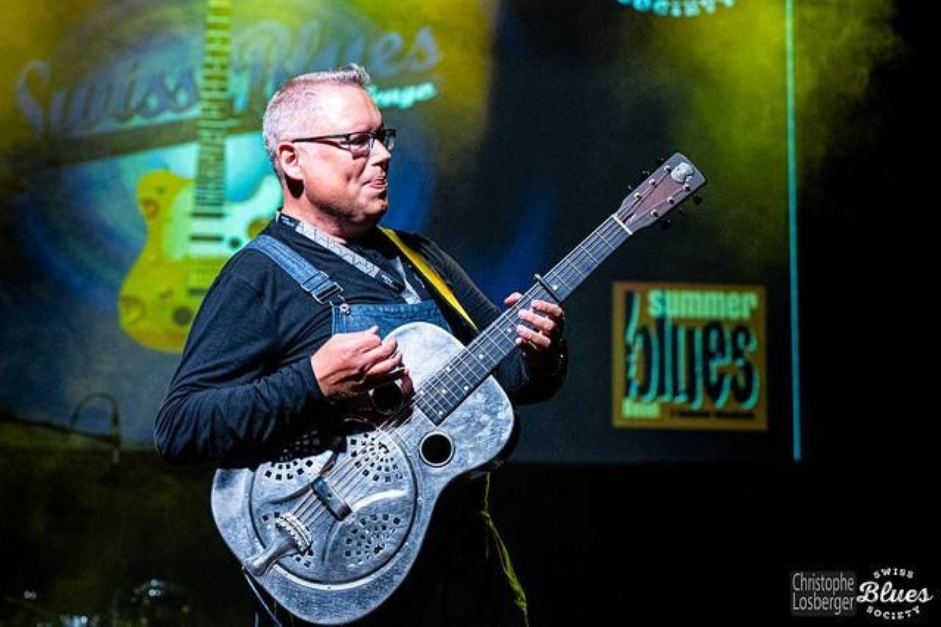 A musician performing the resonator guitar