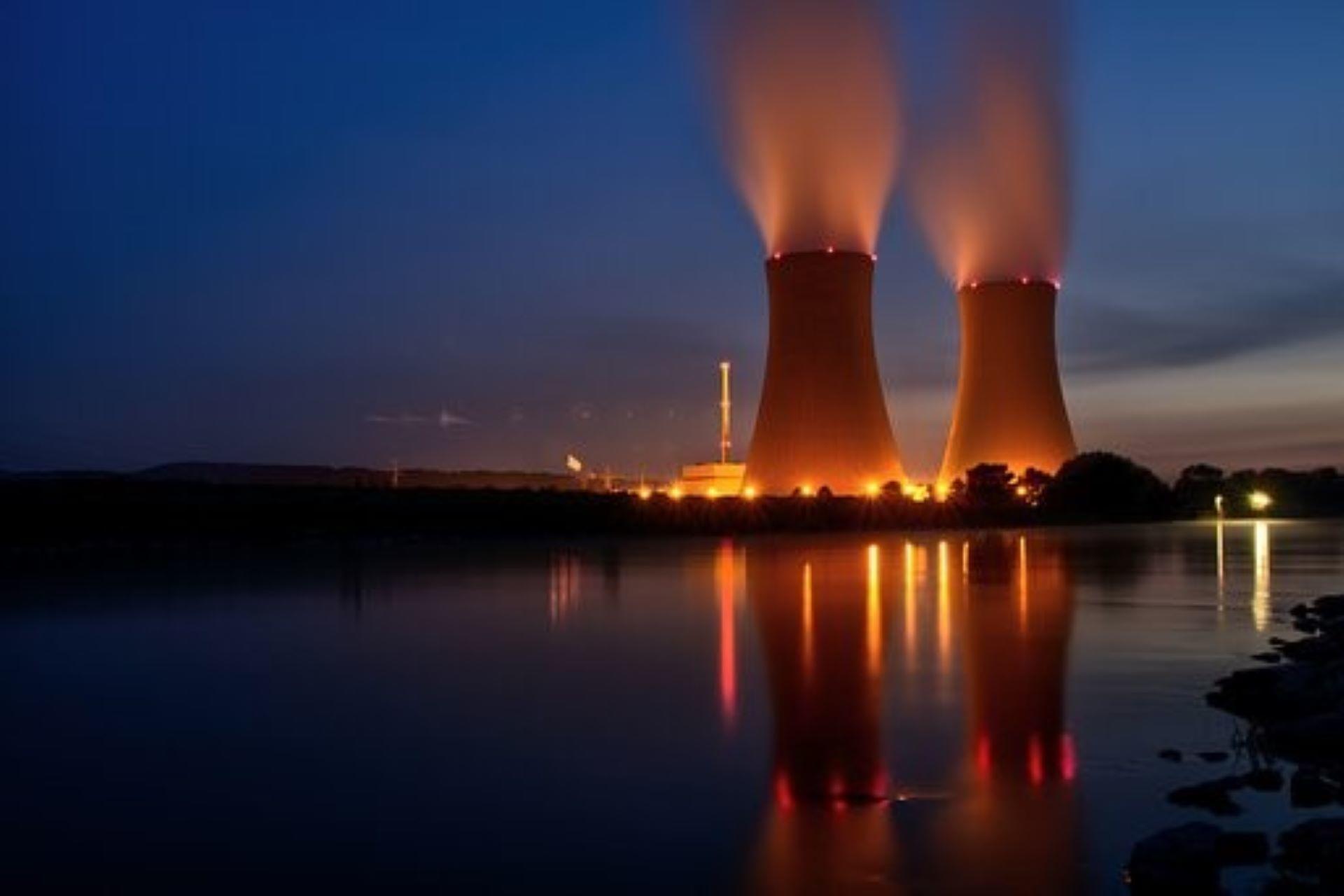 A nuclear energy power plant emitting smoke.