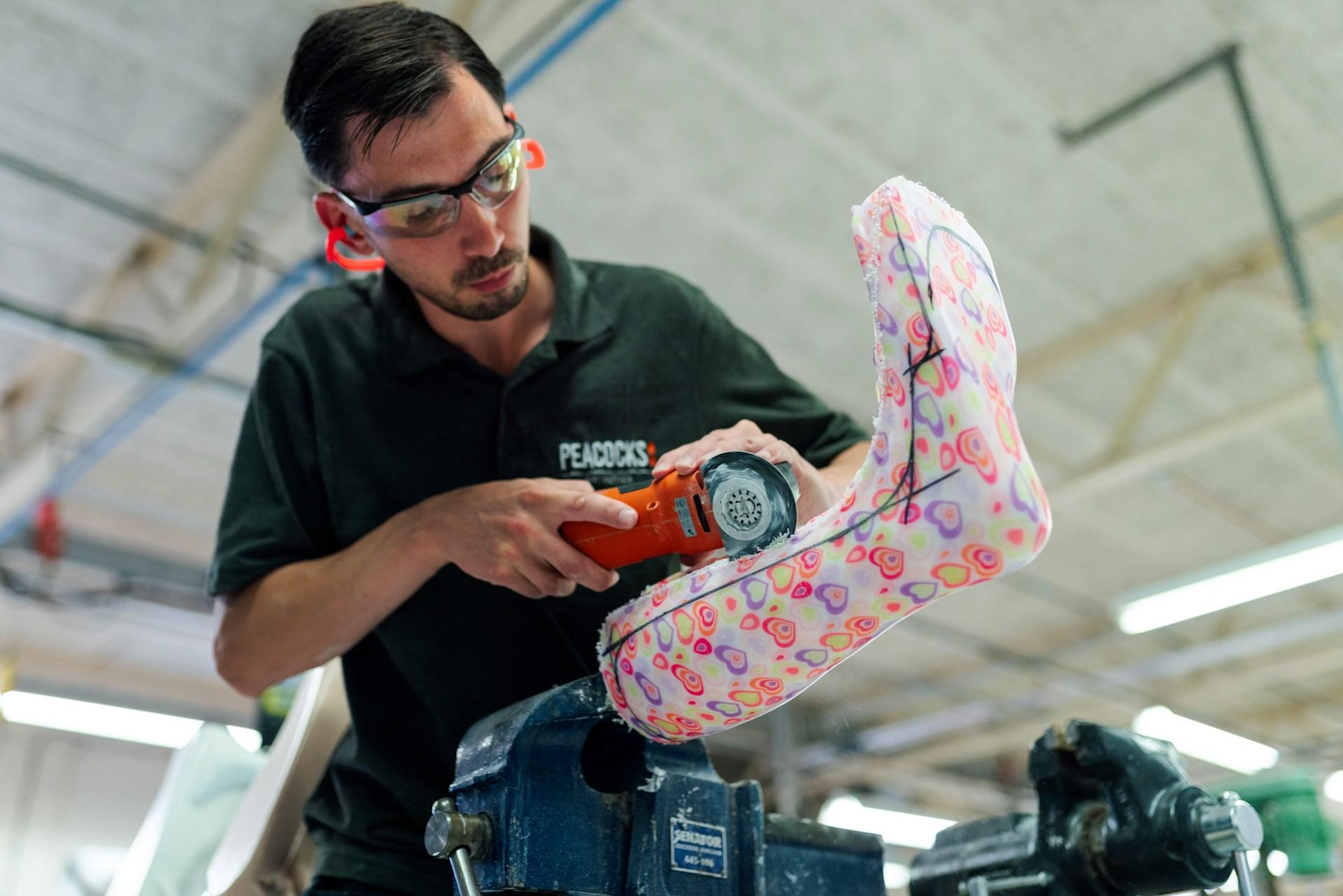 An engineer working on a rubber boot.