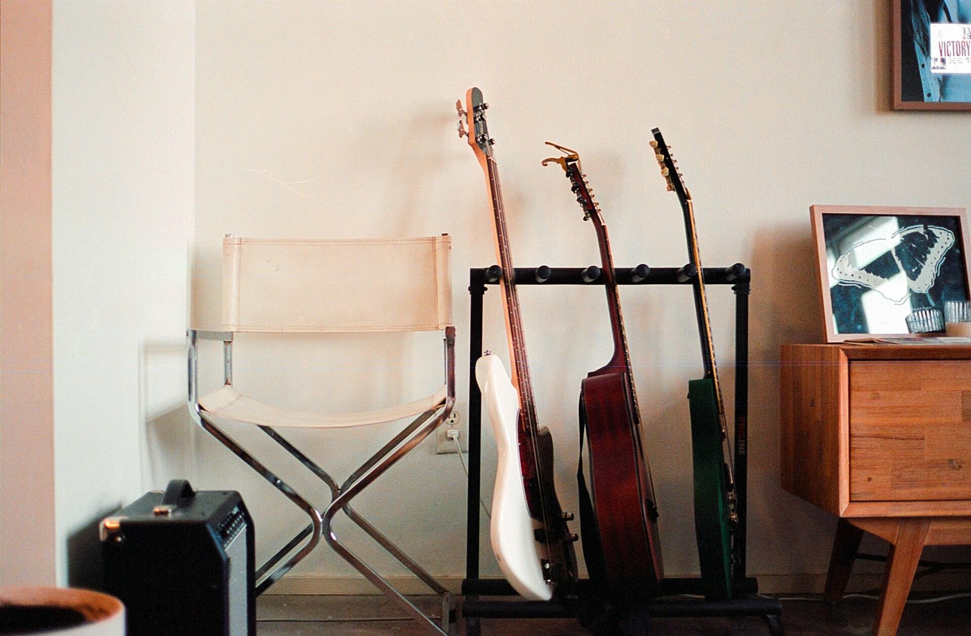 Three guitars in a music room.