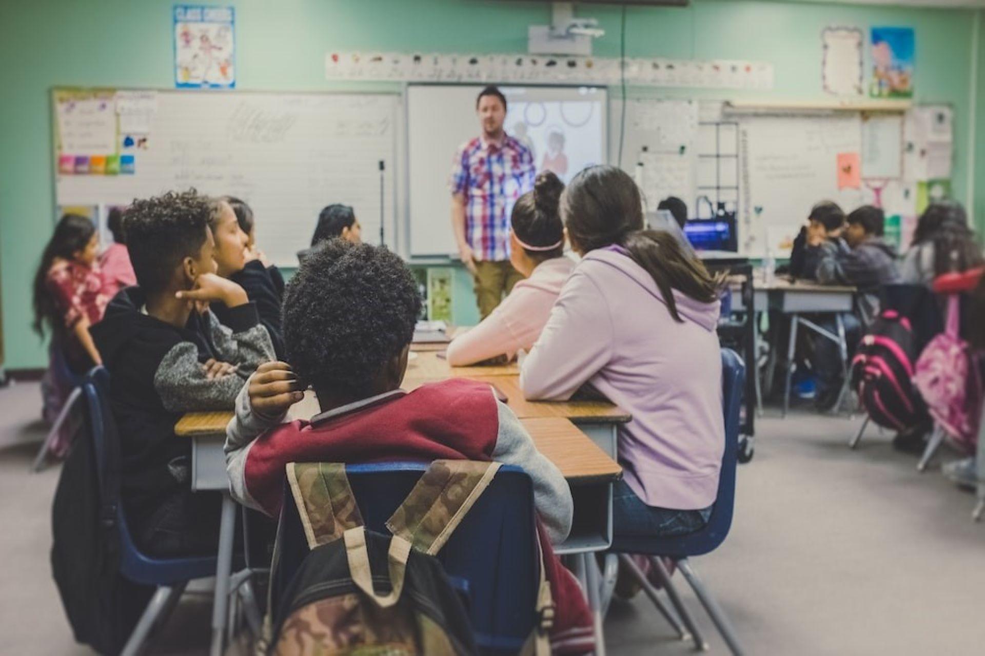 Students intently listening to their tutor.
