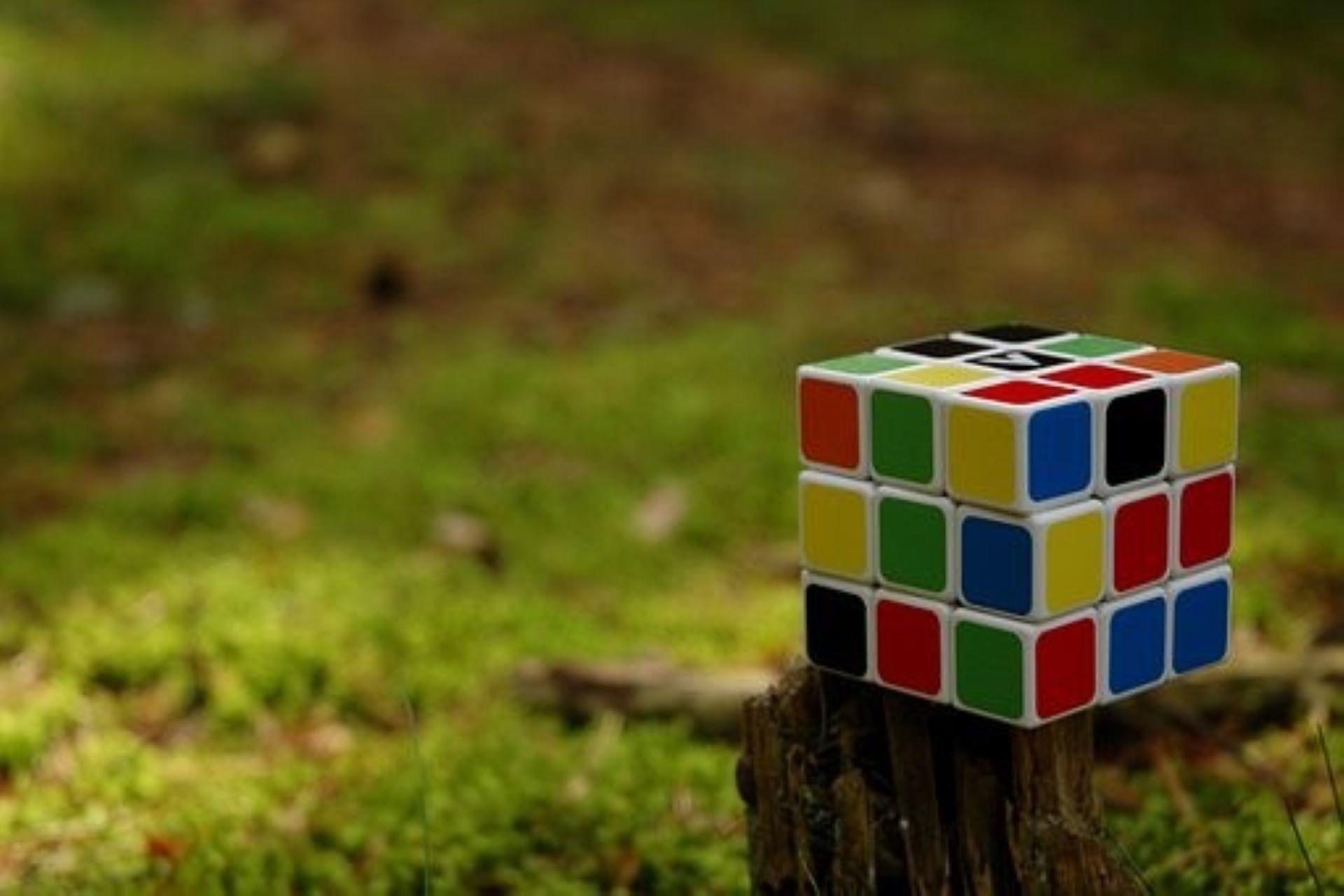 A cube lying on the wood.