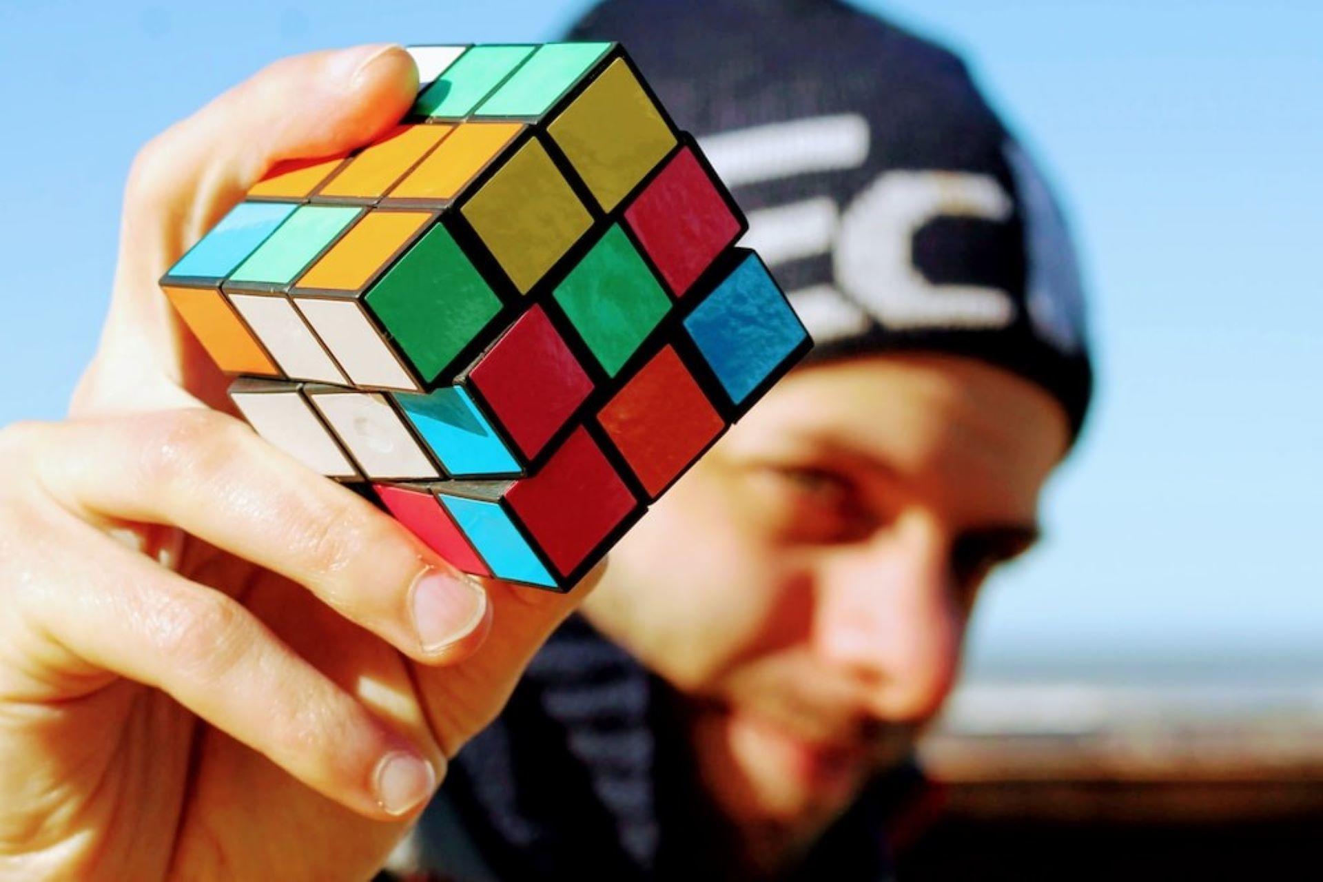 A man holding a Rubik's Cube.