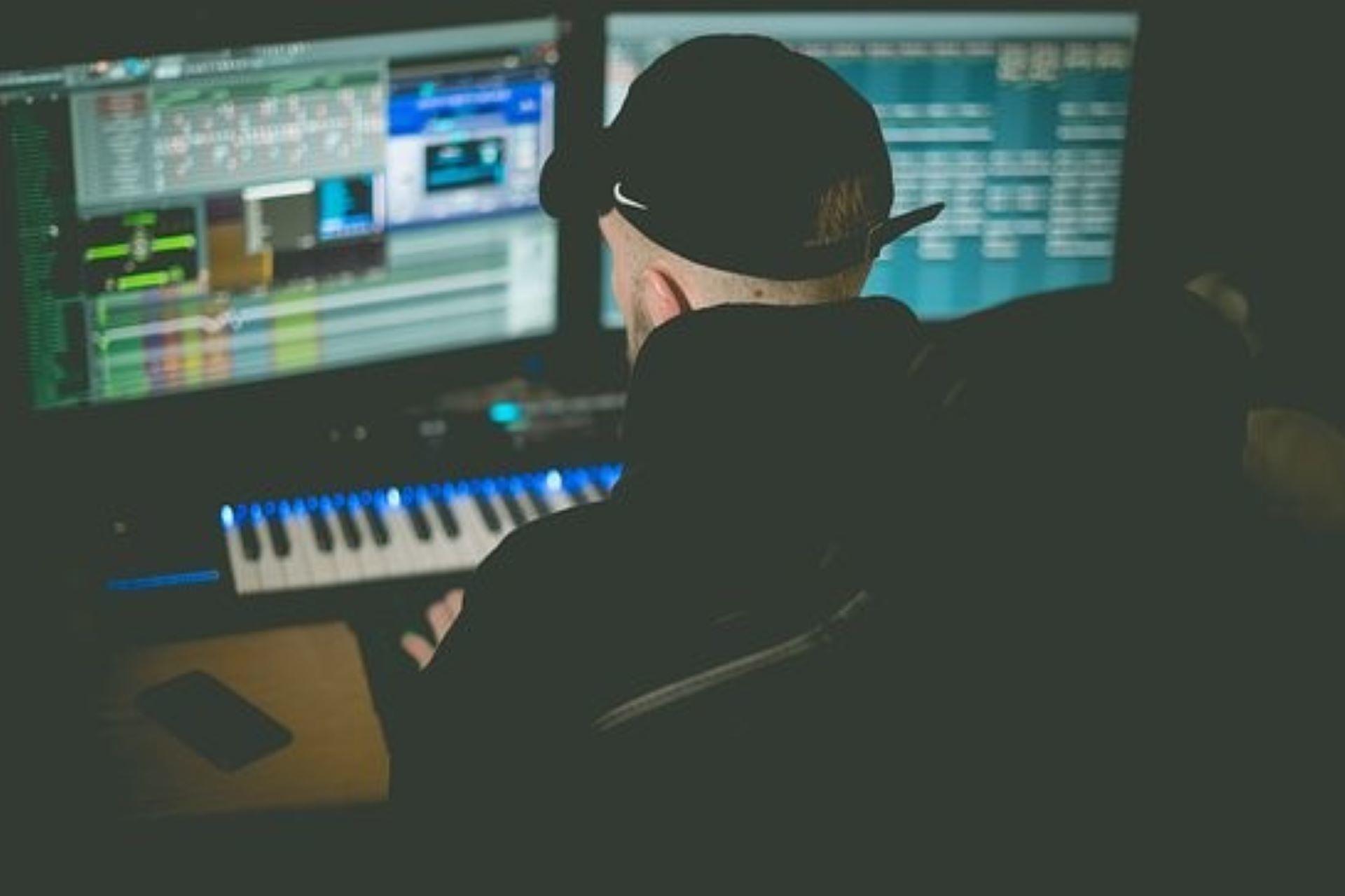 A music producer working on composing a song or music.