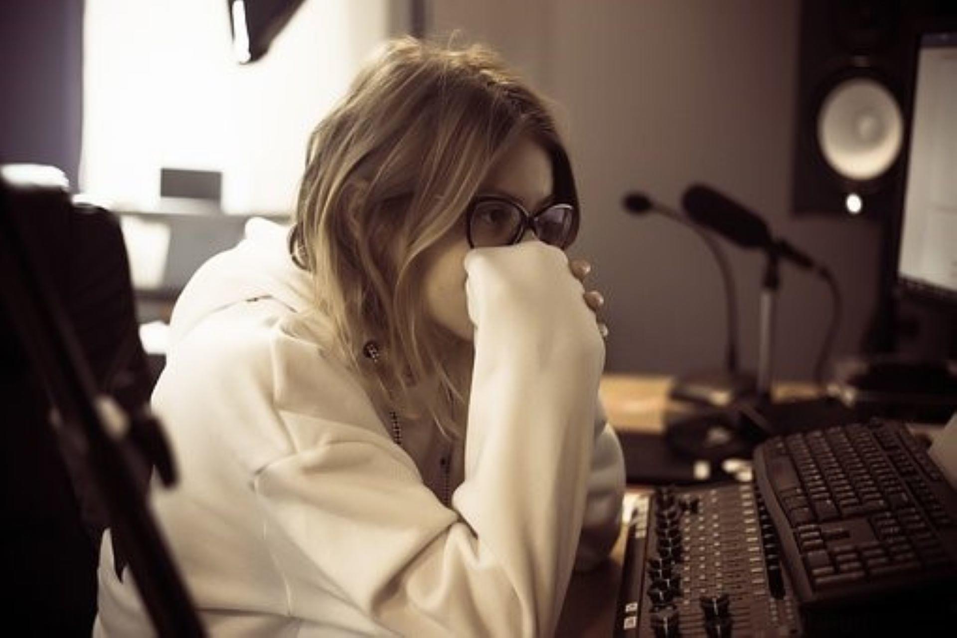 A woman learning how to become a record music producer.