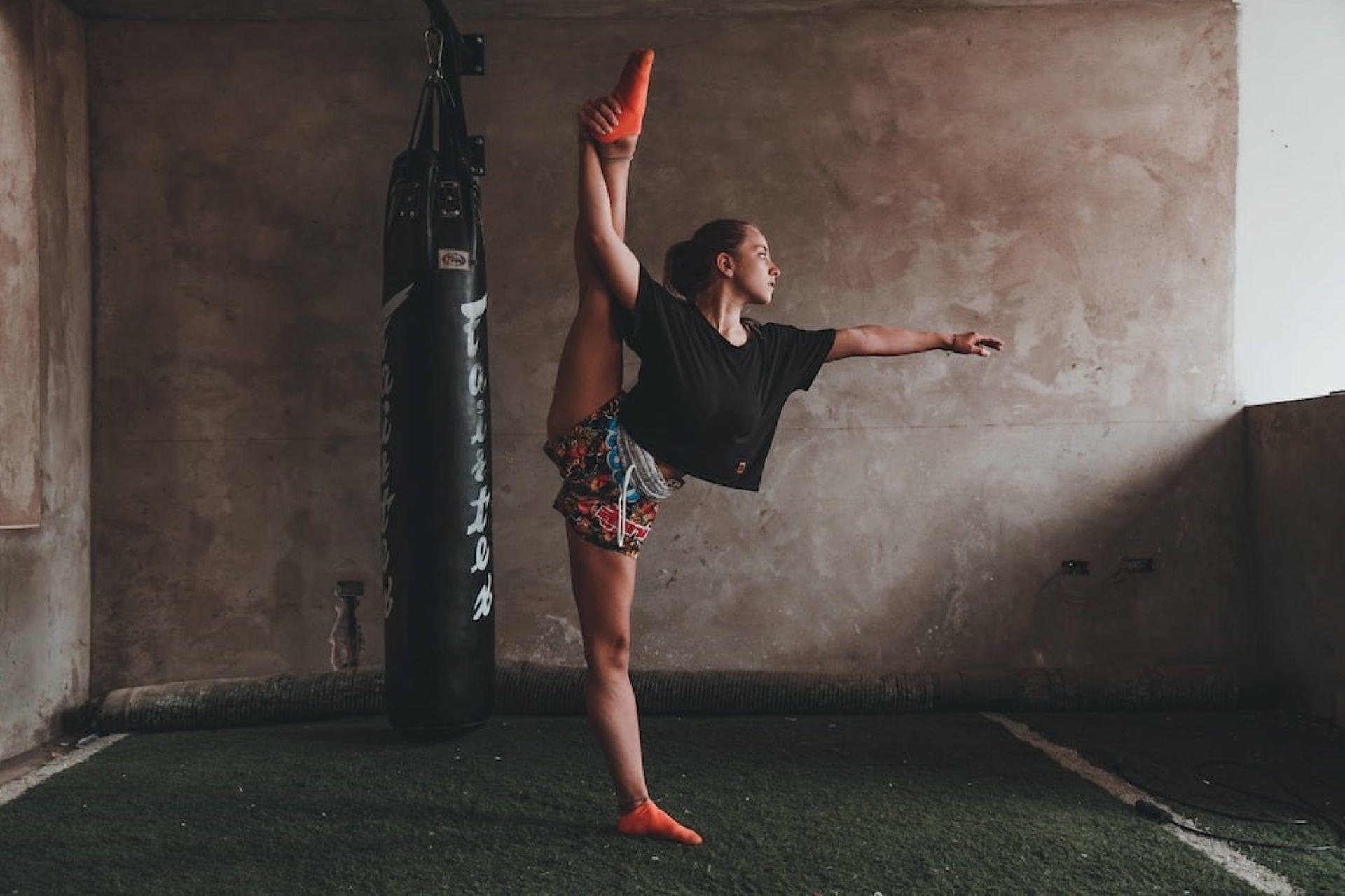A woman performing a split.