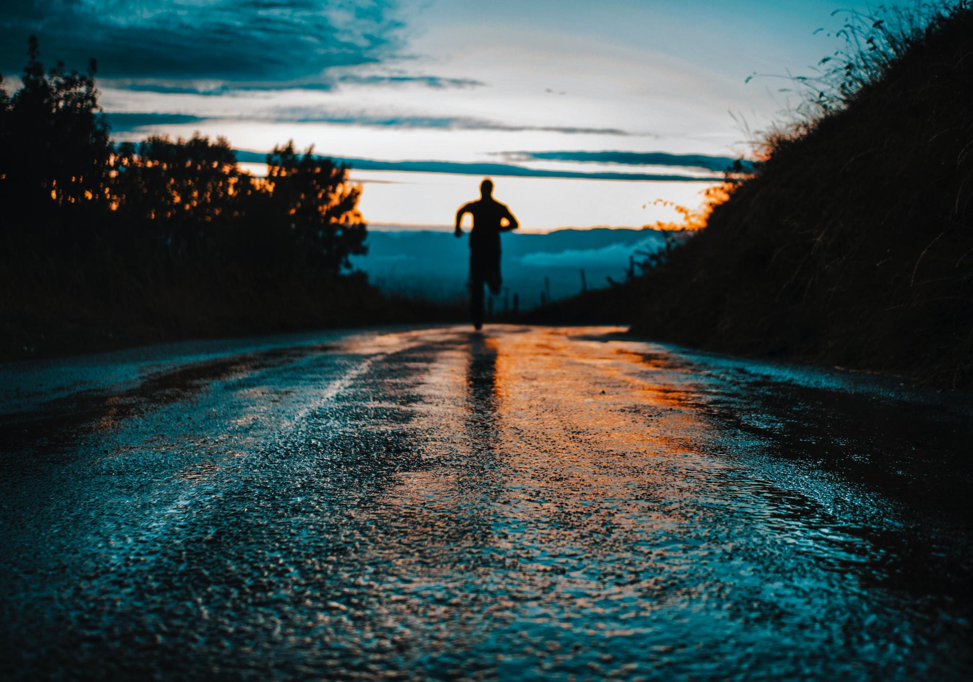 A person running at sunrise