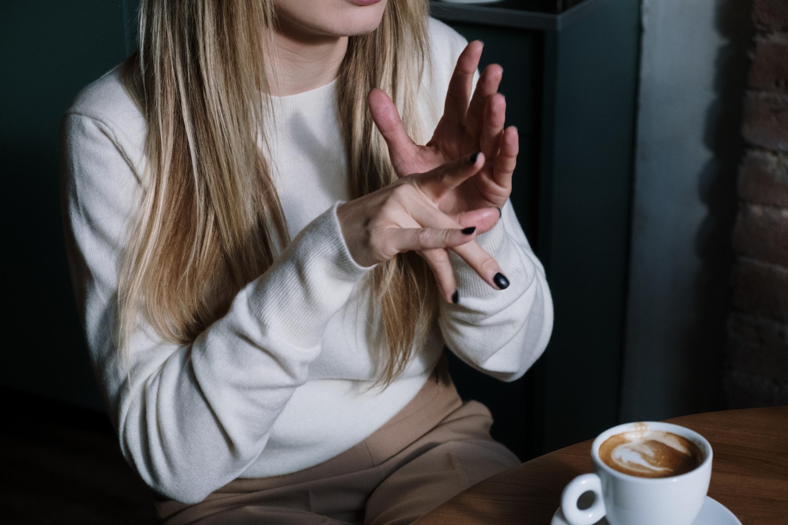 A person communicating using signs 