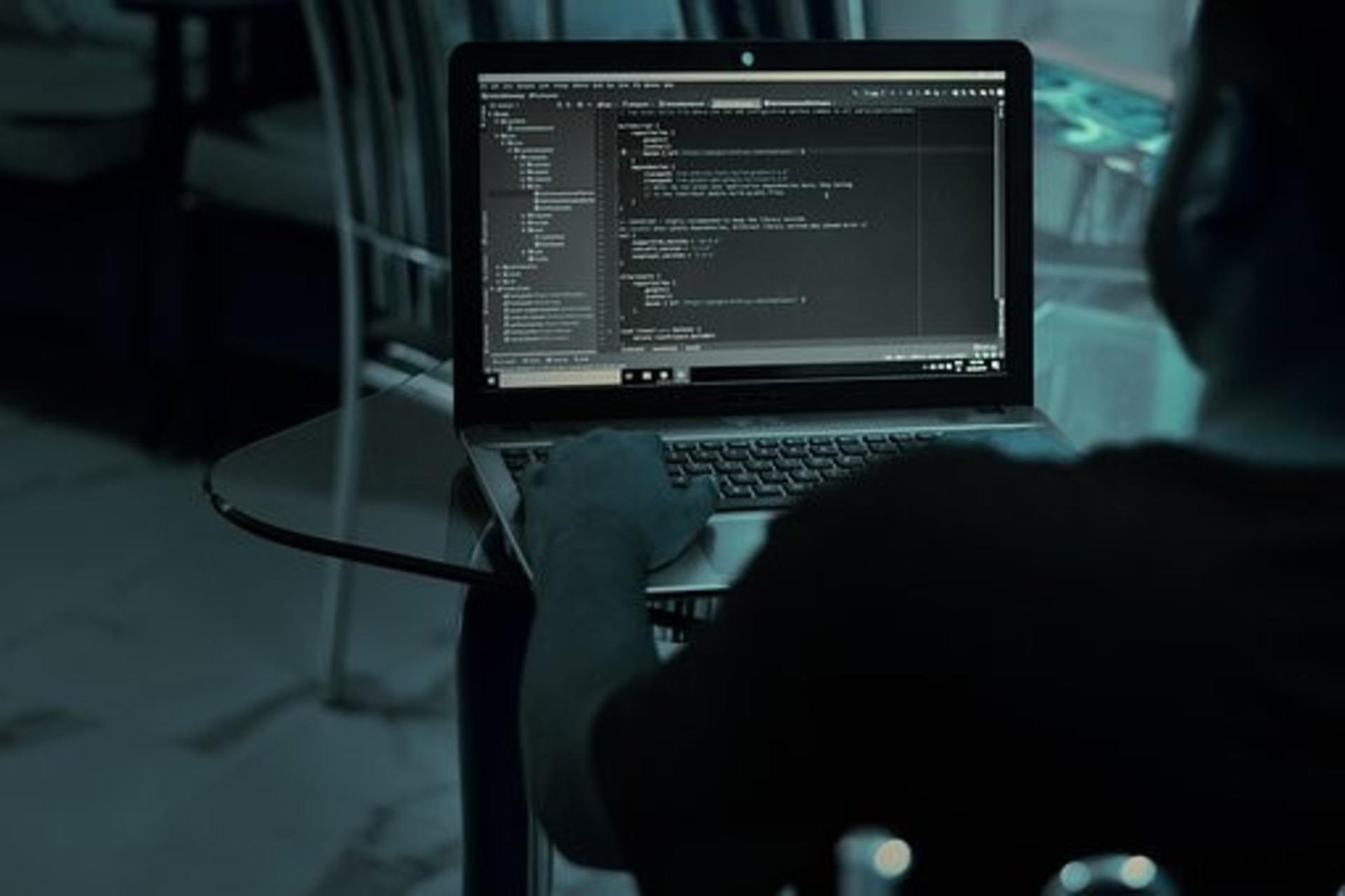 A coder working on his laptop.