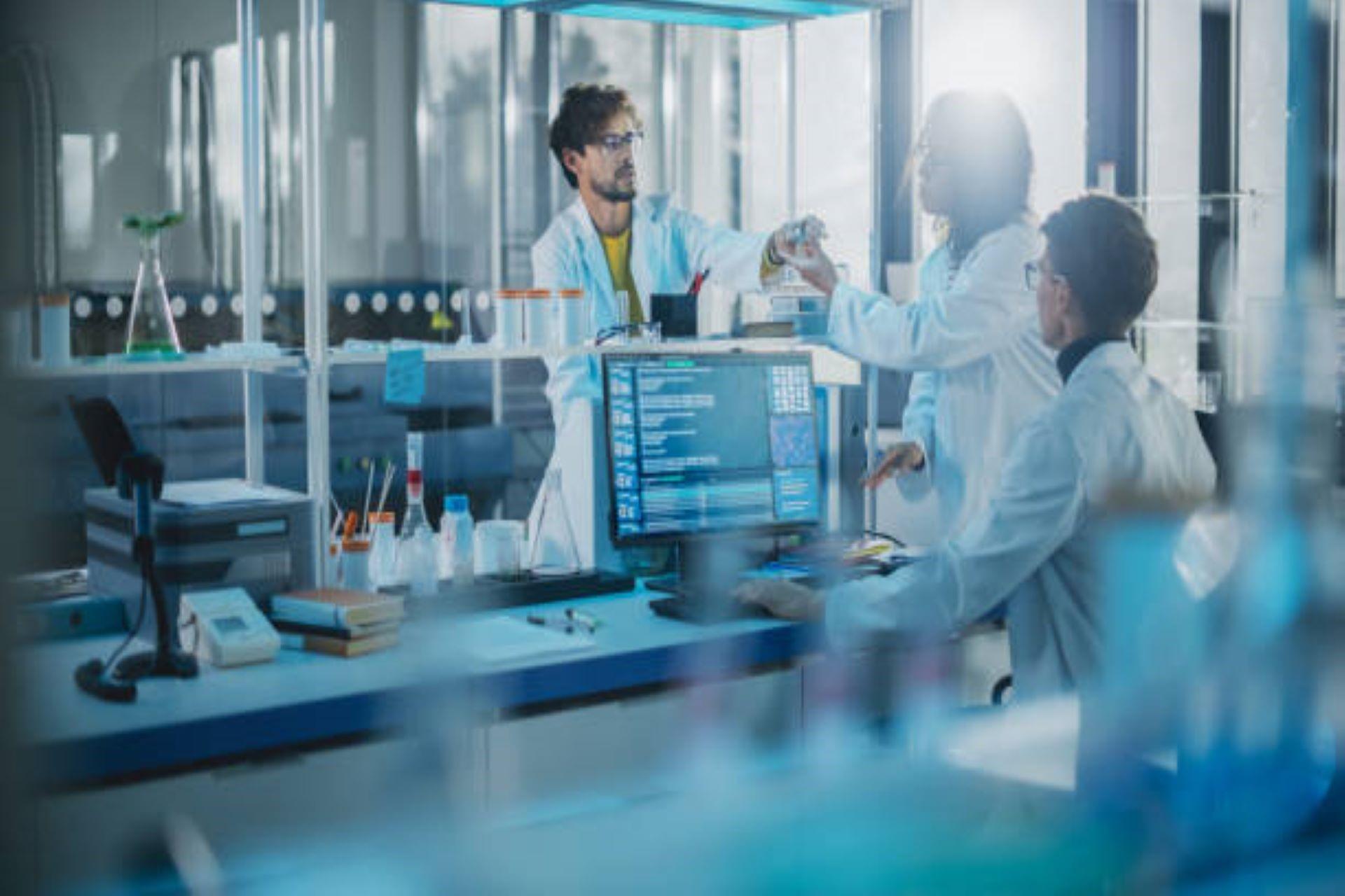 Scientists working in a modern medicine research laboratory