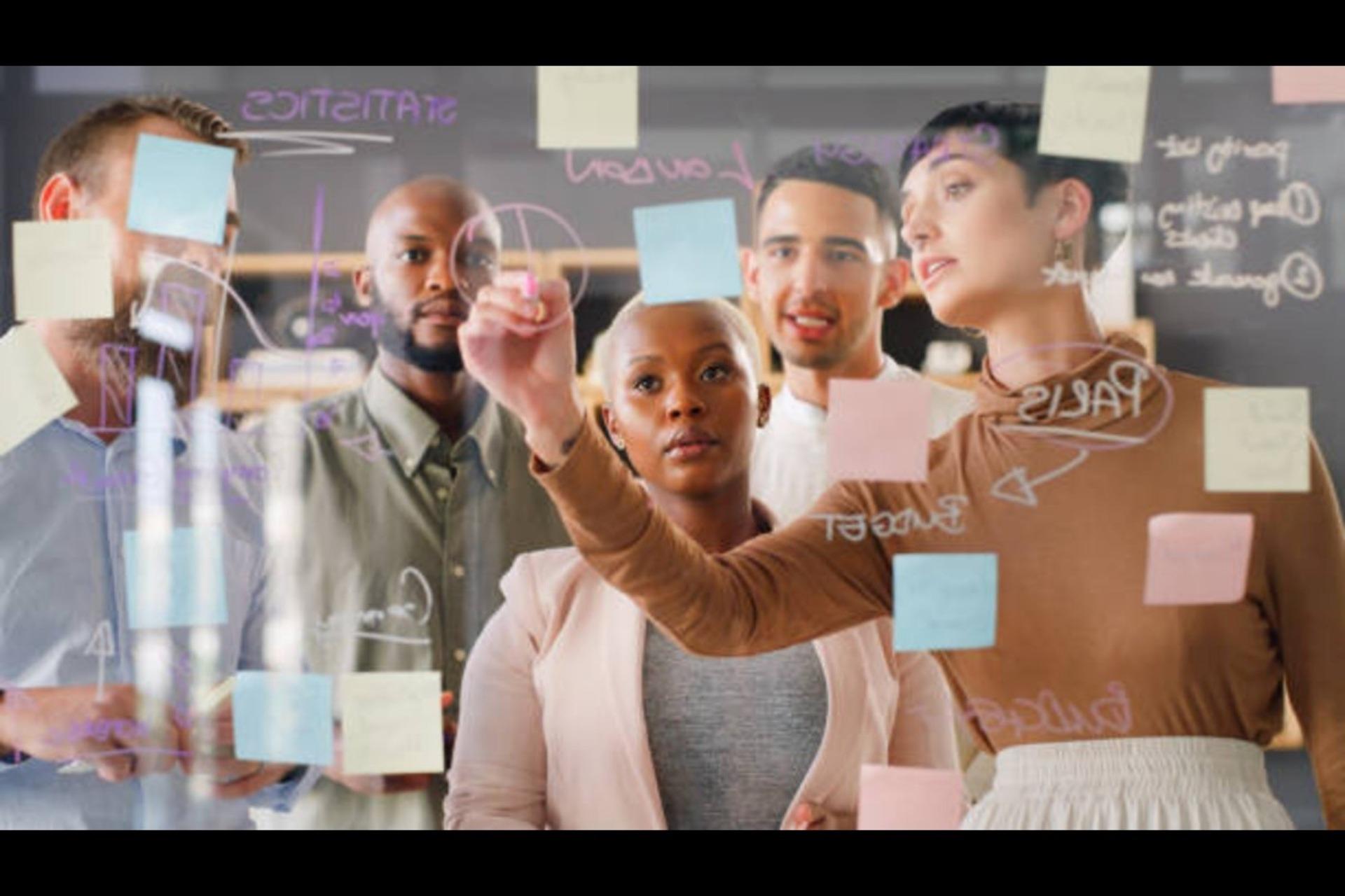 A project manager briefing employees on the project outline