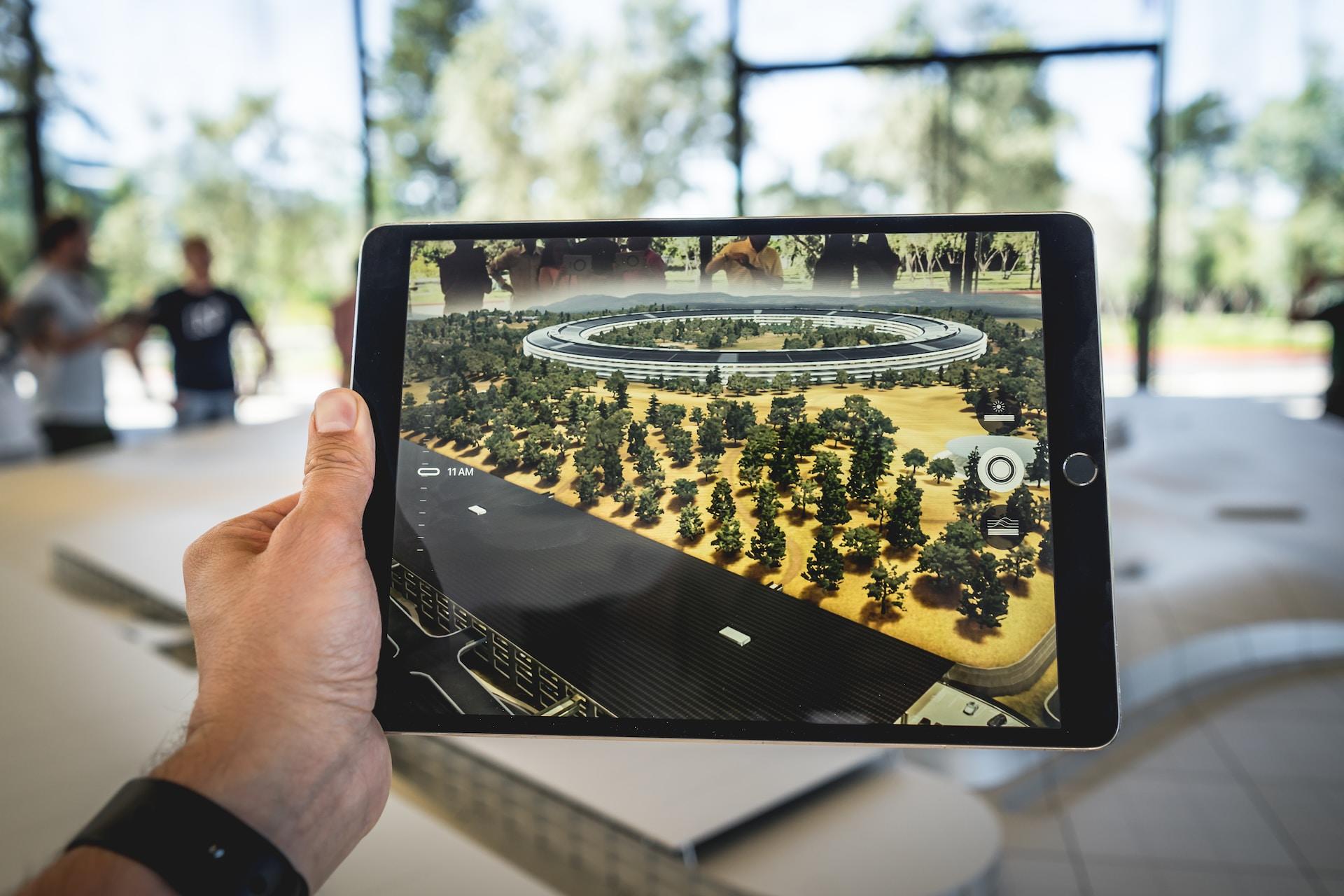 A tablet shows a prototype of a video game environment