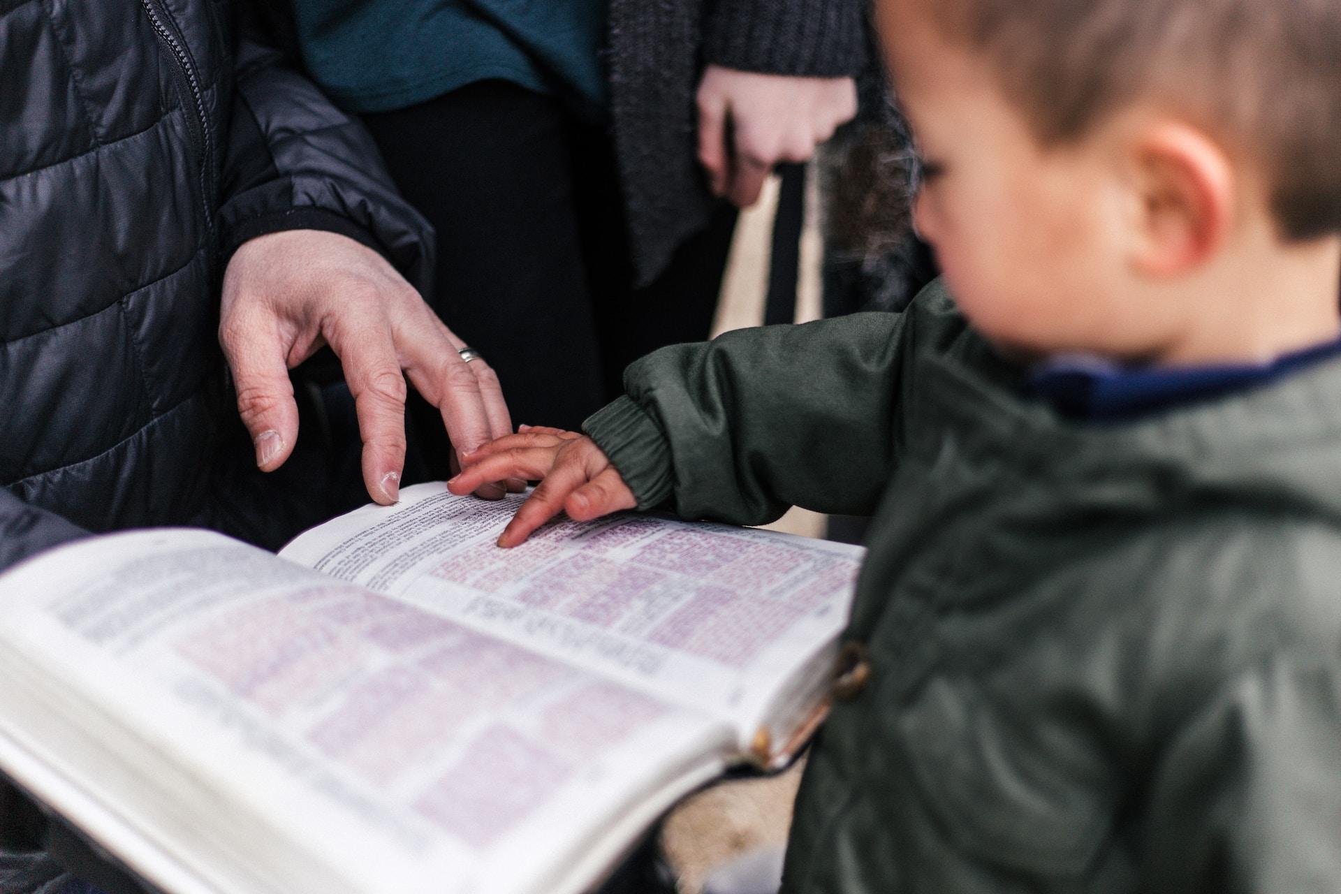 Boy learning how to read.