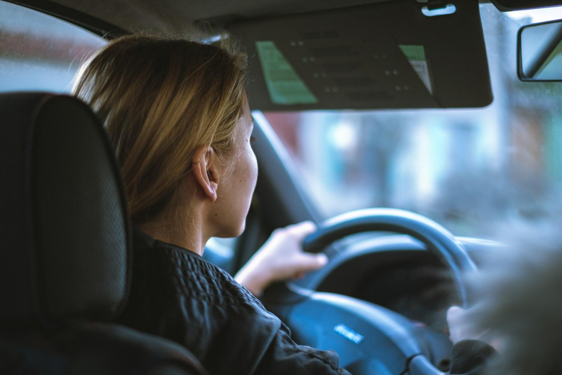 A person driving a car.