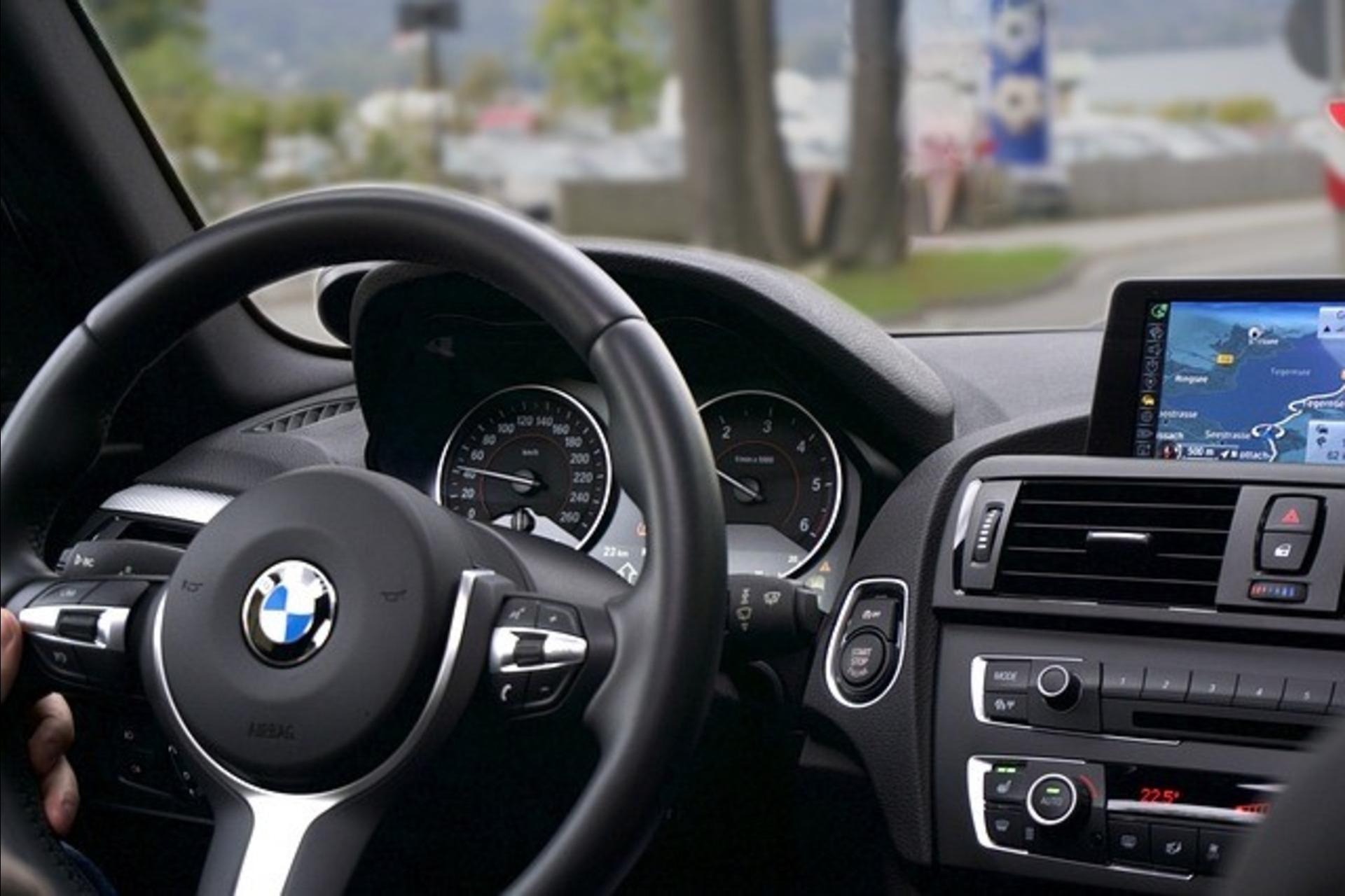A BMW's steering wheel and center console.
