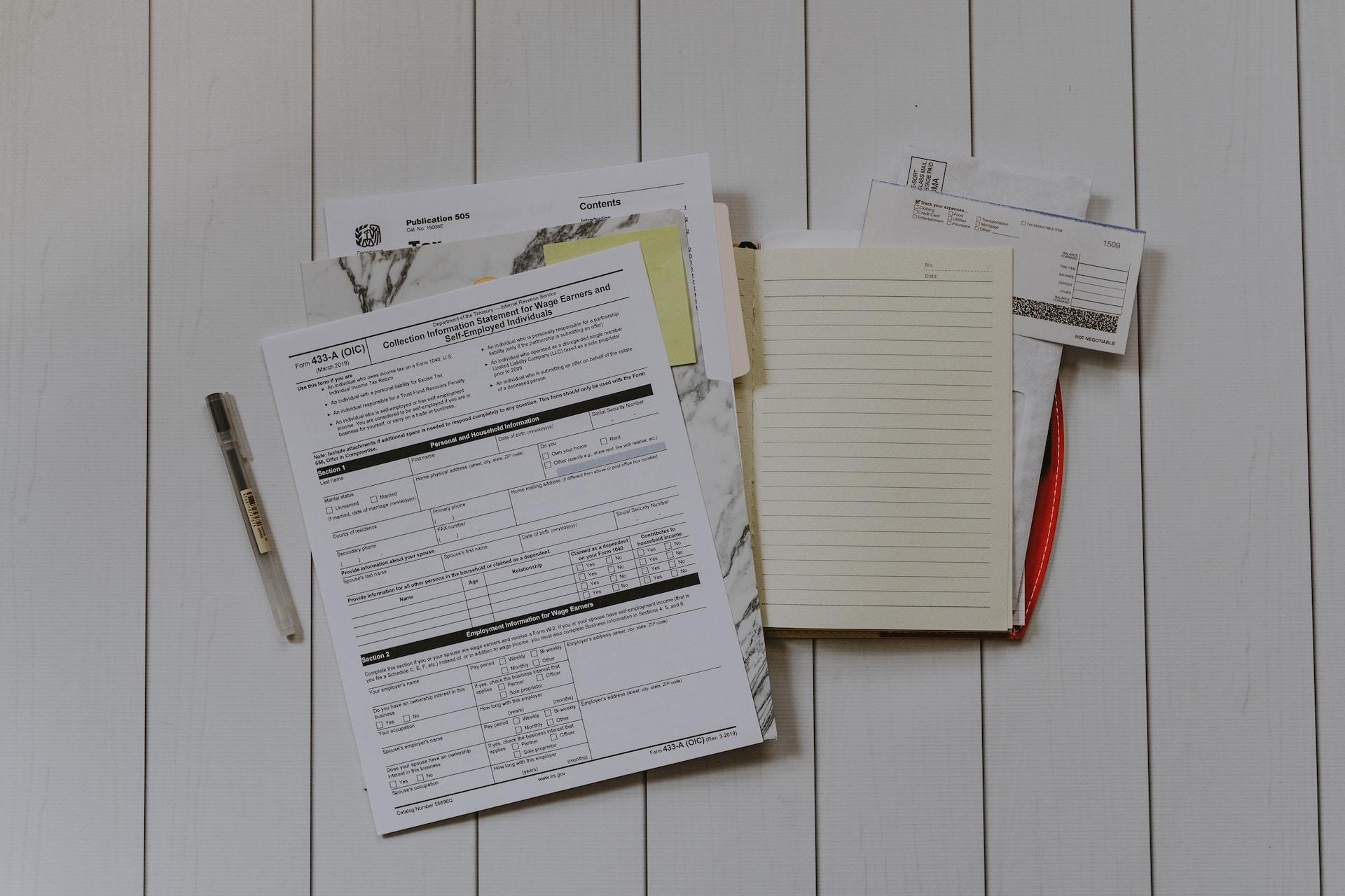 Accounting documents on a desk.