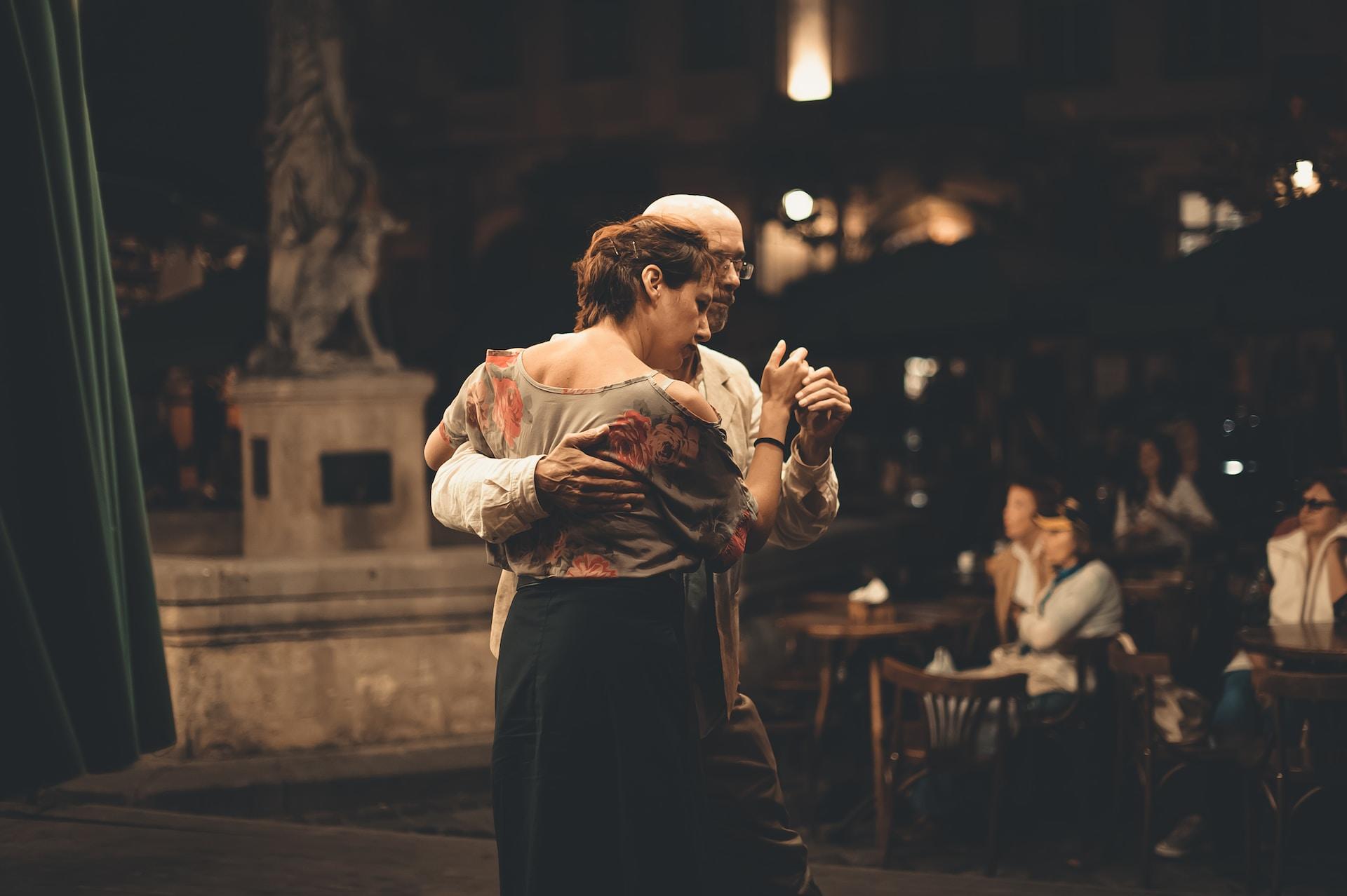 An older couple lovingly dancing together