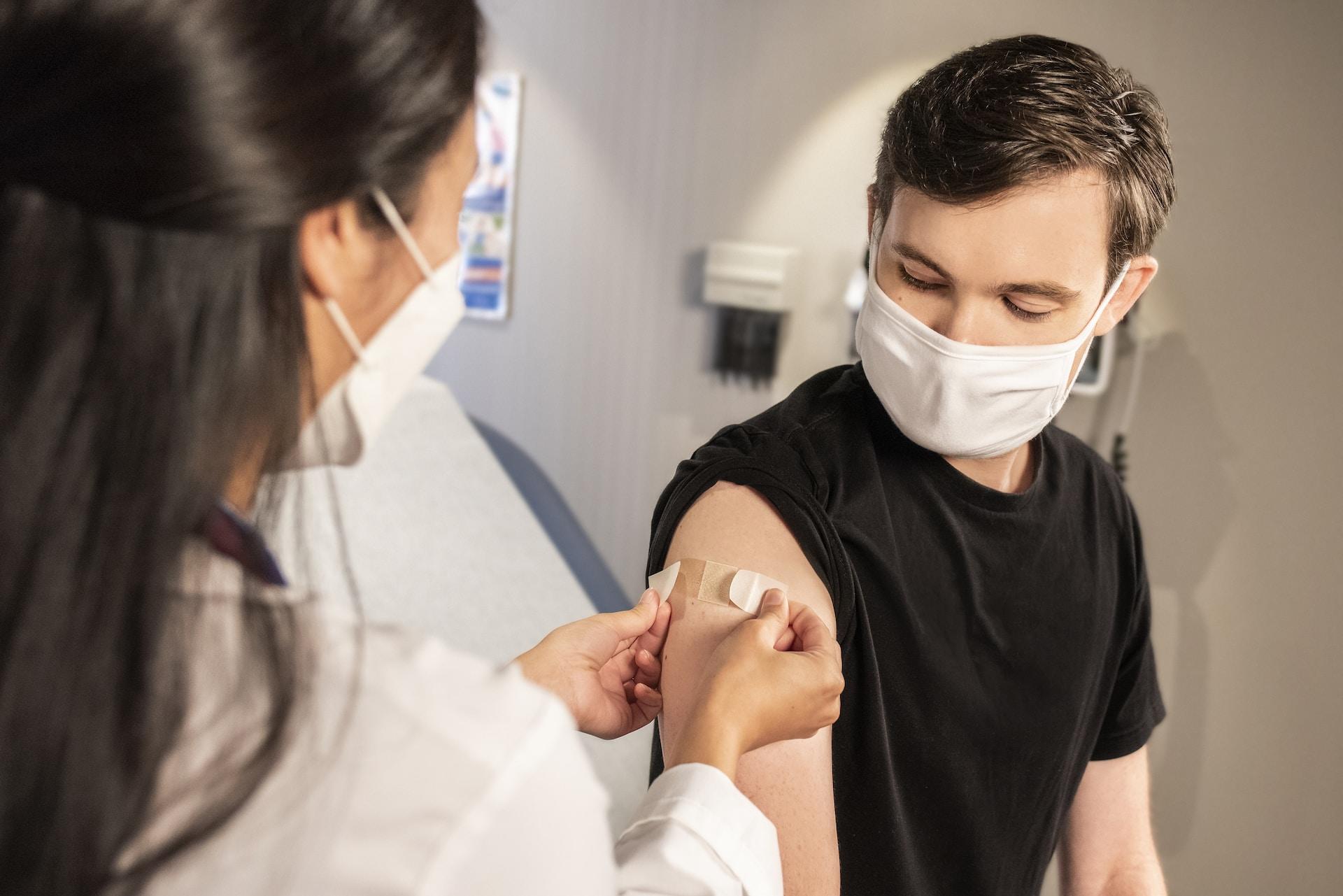 A young person receiving a vaccine.